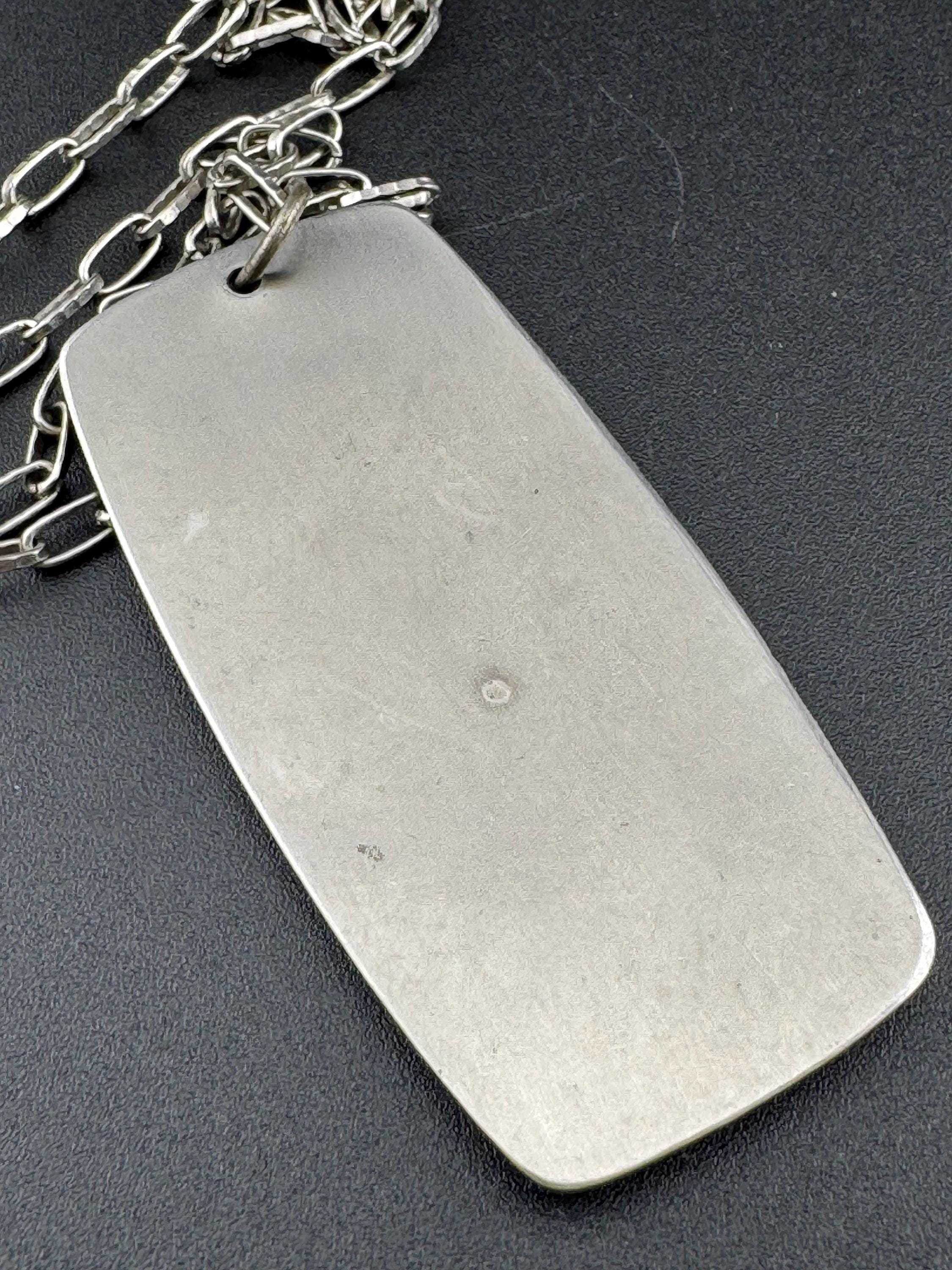 Vintage Modernist silver tone stainless steel pendant necklace and chain set with central bright green design 1970s