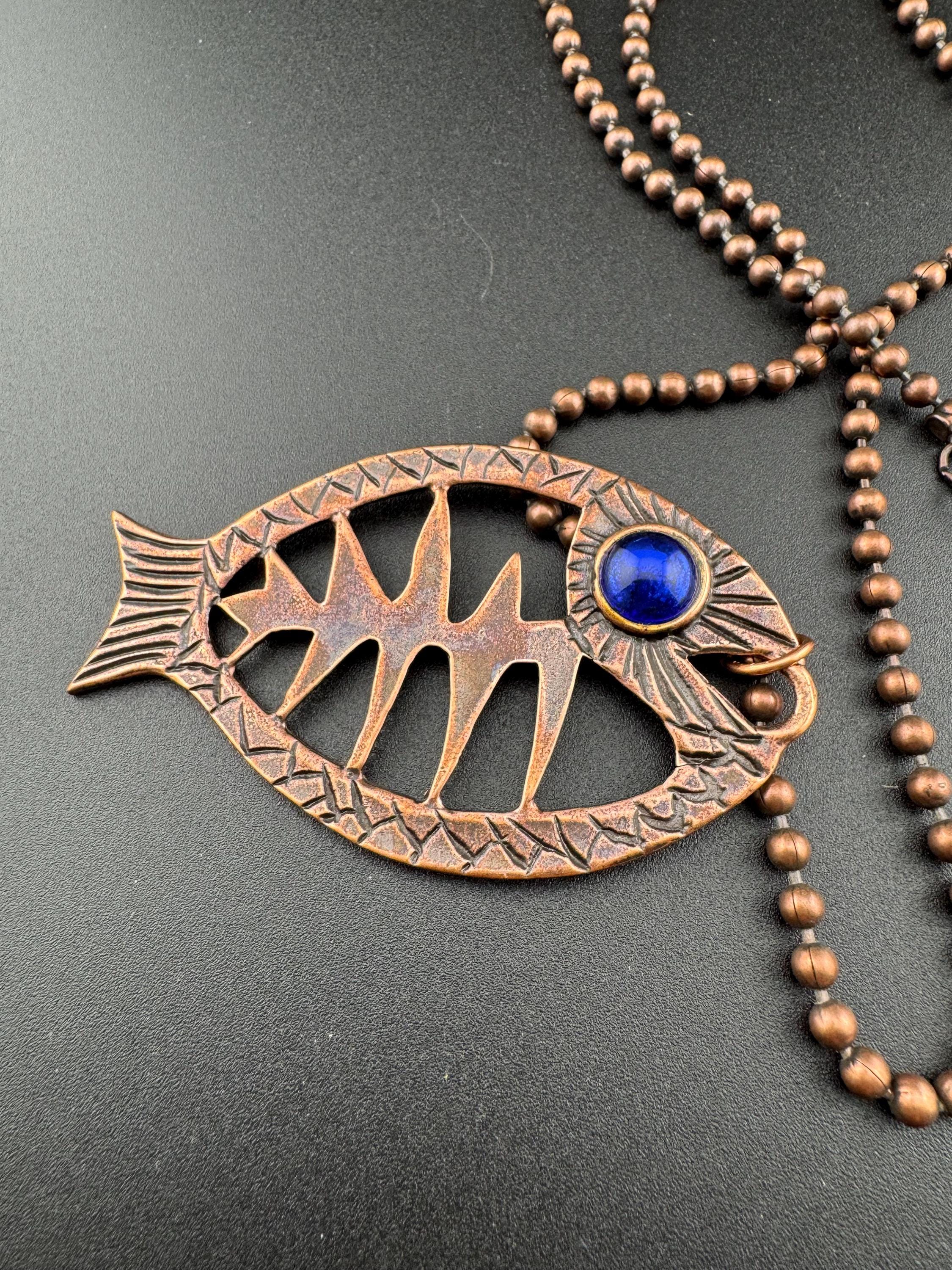Vintage c 1980s copper tone fish pendant on a 75cm ball bead long chain necklace, blue glass eyes on both sides