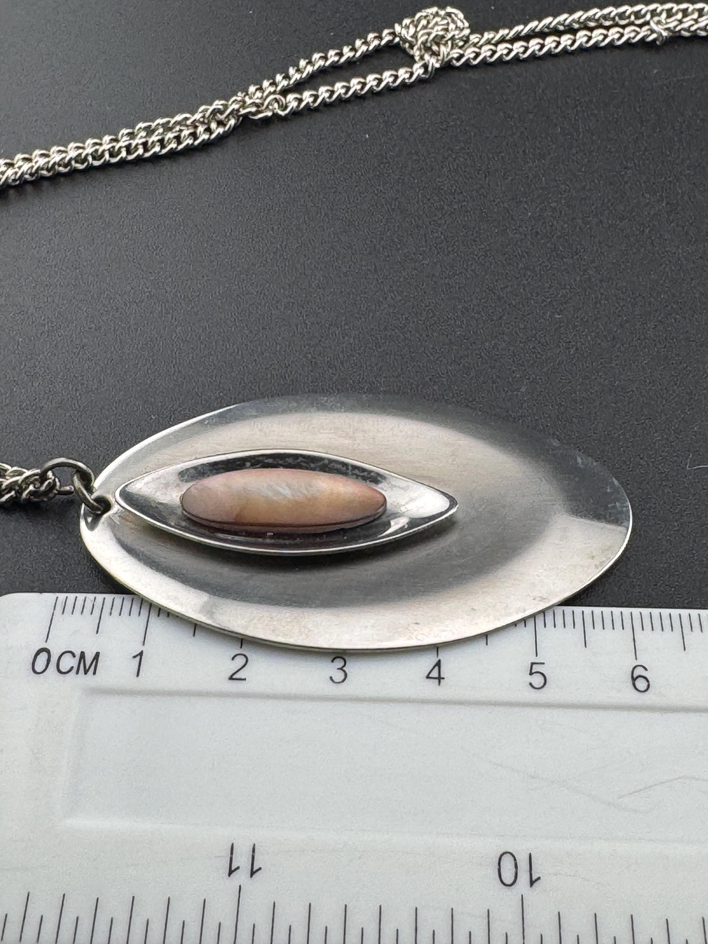 Vintage Modernist silver tone stainless steel pendant necklace and chain set with central pink taupe cabochon 1970s