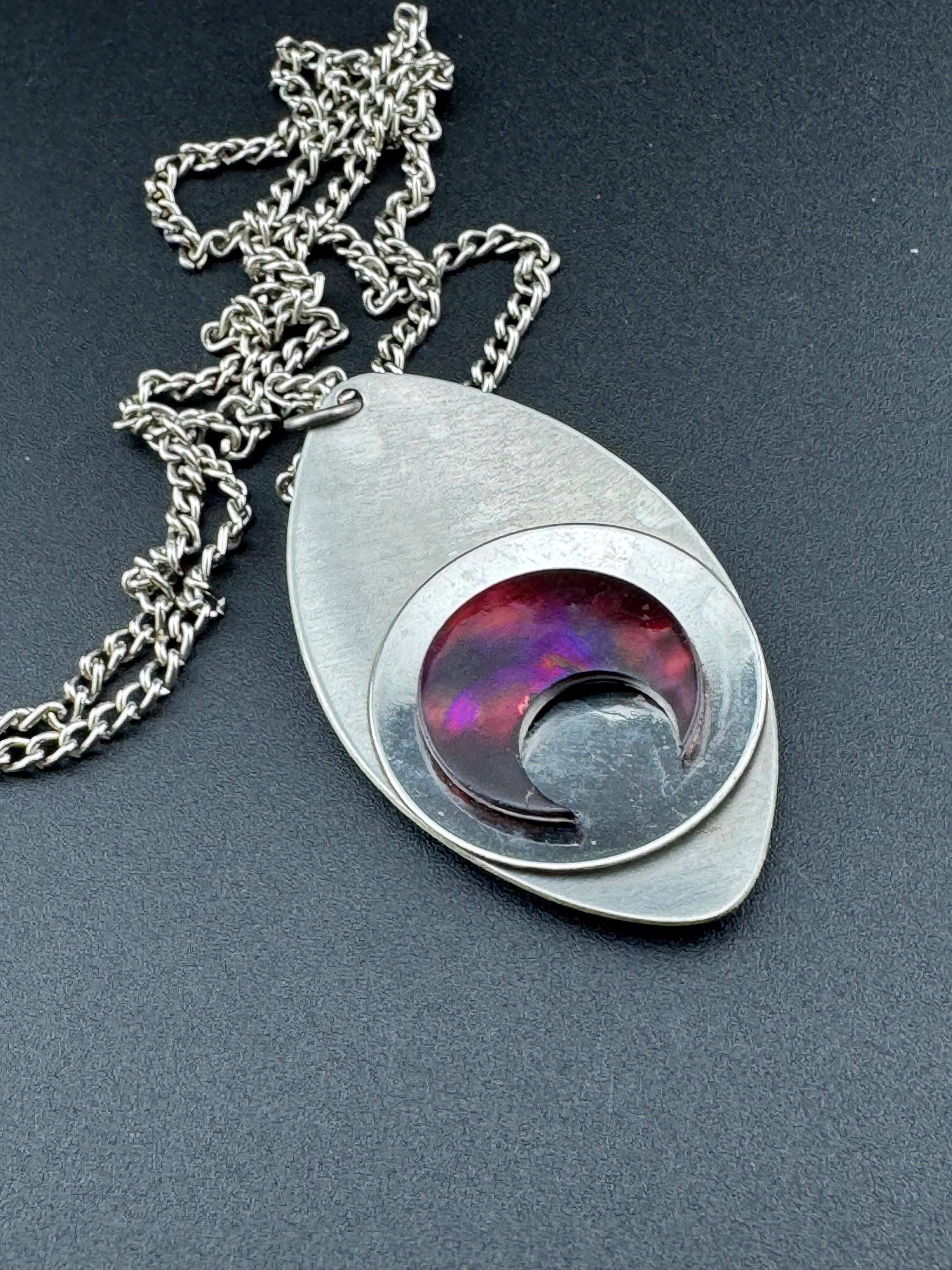 Vintage Modernist silver tone stainless steel pendant necklace and chain set with central purple glass crescent moon cabochon 1970s