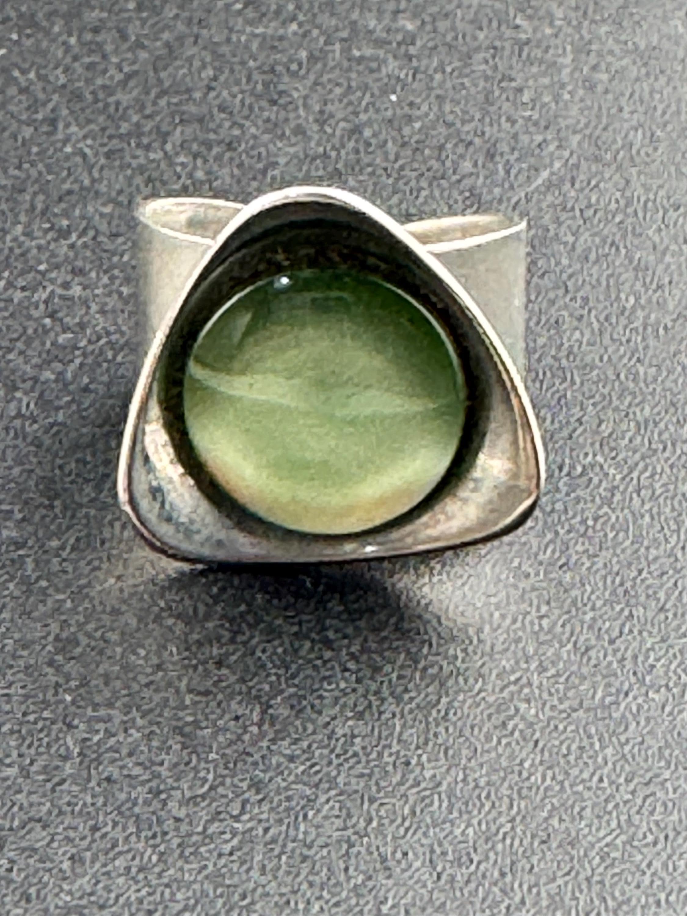 1970s vintage stainless steel silver metal adjustable ring with central green cabochon mid century