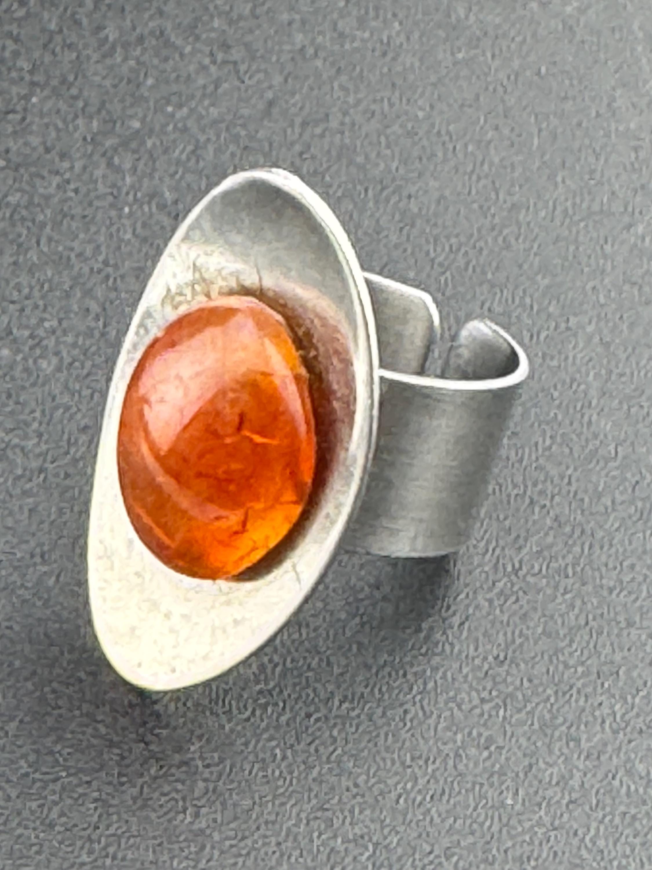 1970s vintage stainless steel silver metal adjustable ring with central orange cabochon mid century