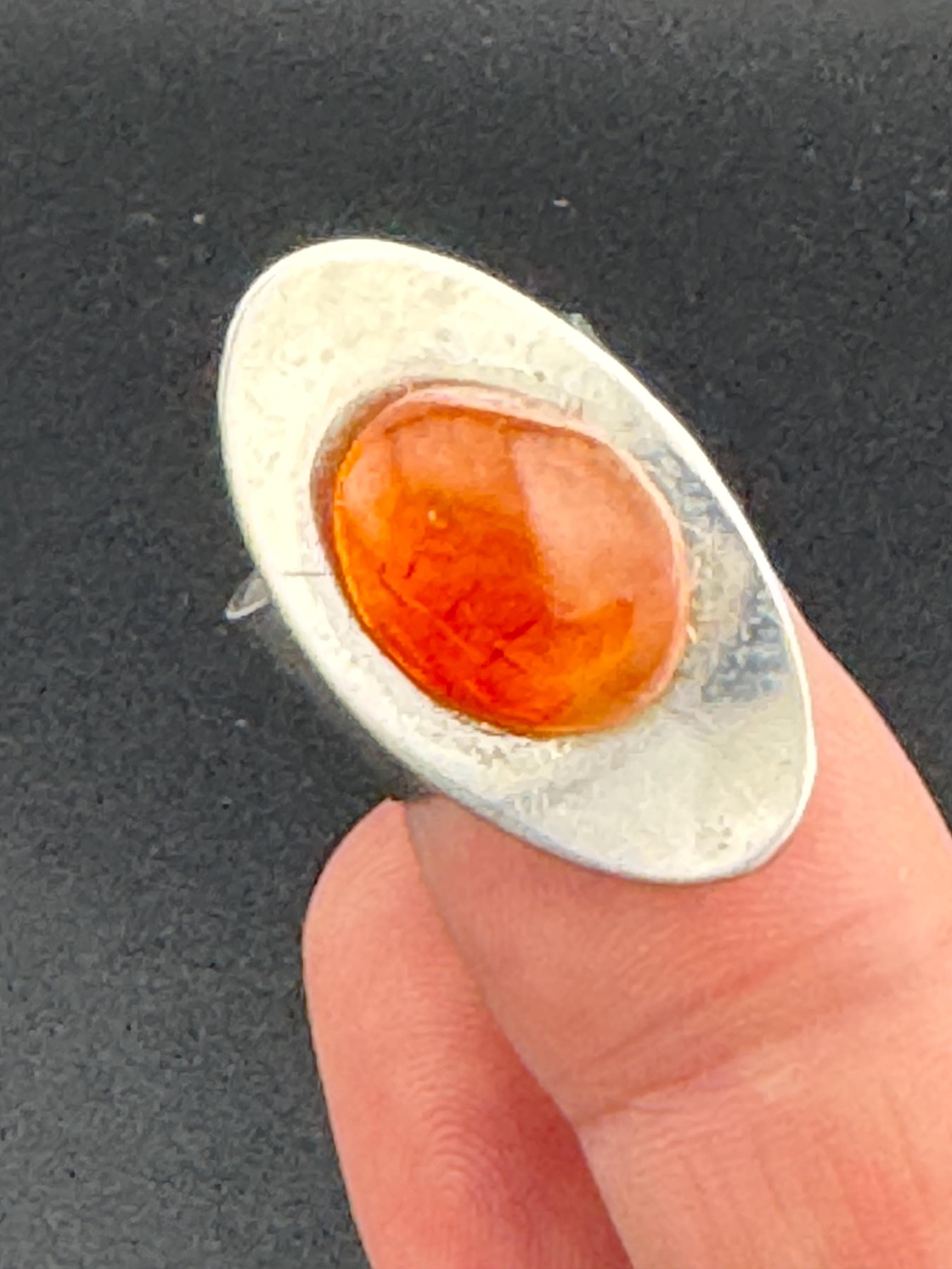 1970s vintage stainless steel silver metal adjustable ring with central orange cabochon mid century