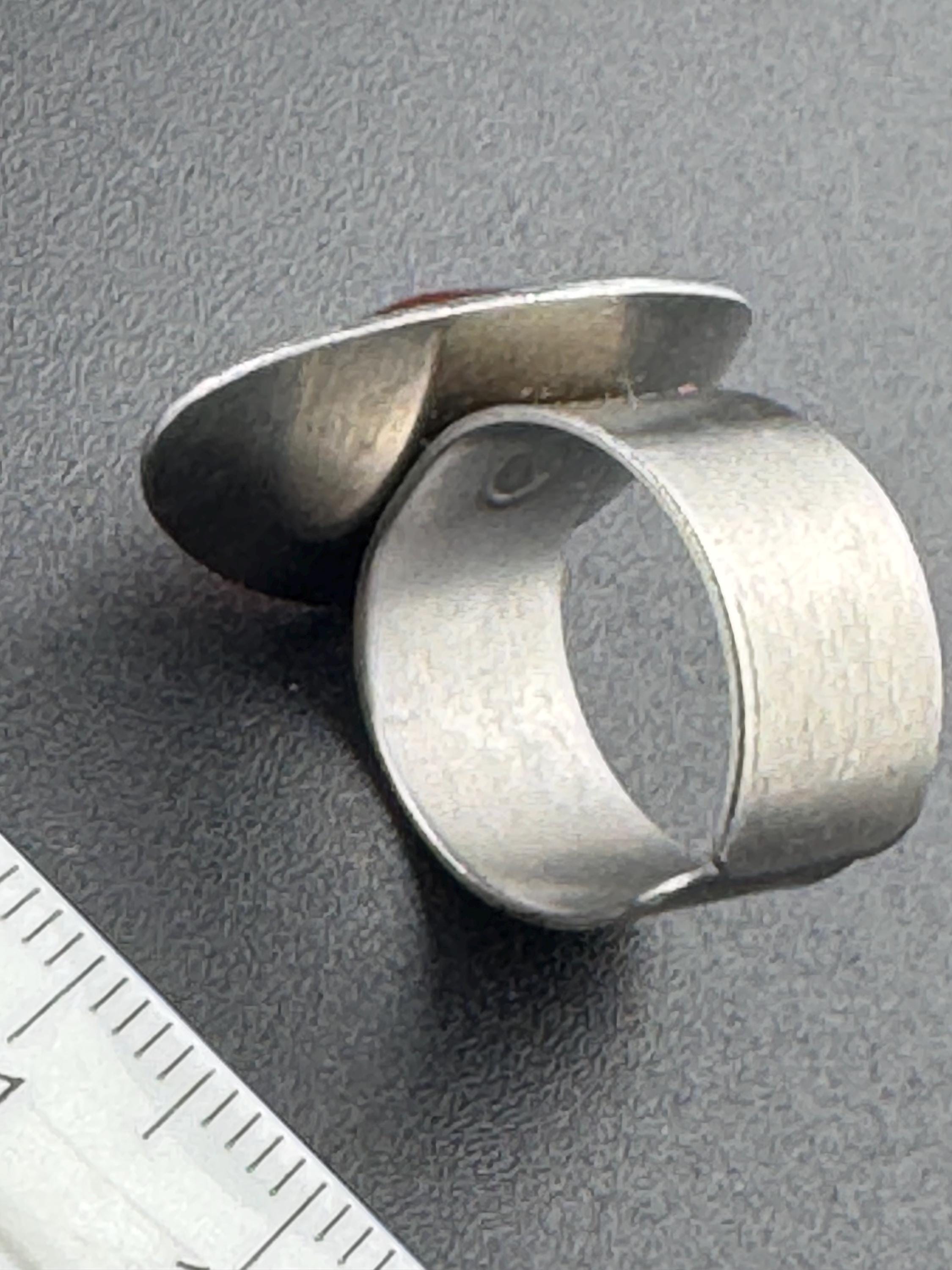 1970s vintage stainless steel silver metal adjustable ring with central orange cabochon mid century