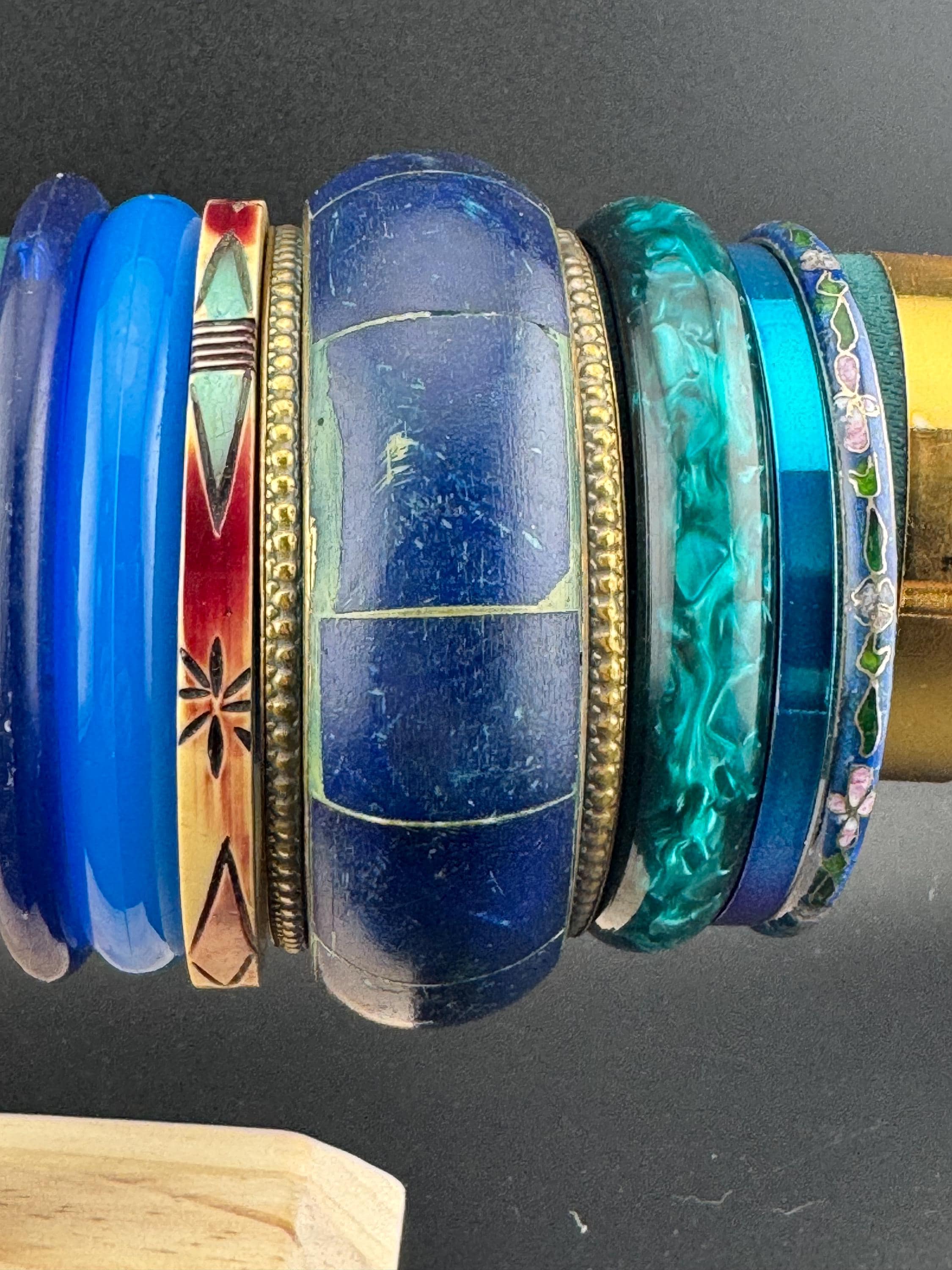 Vintage stack of dark blue purple green tones chunky stylish plastic and metal bangles retro acrylic bracelets