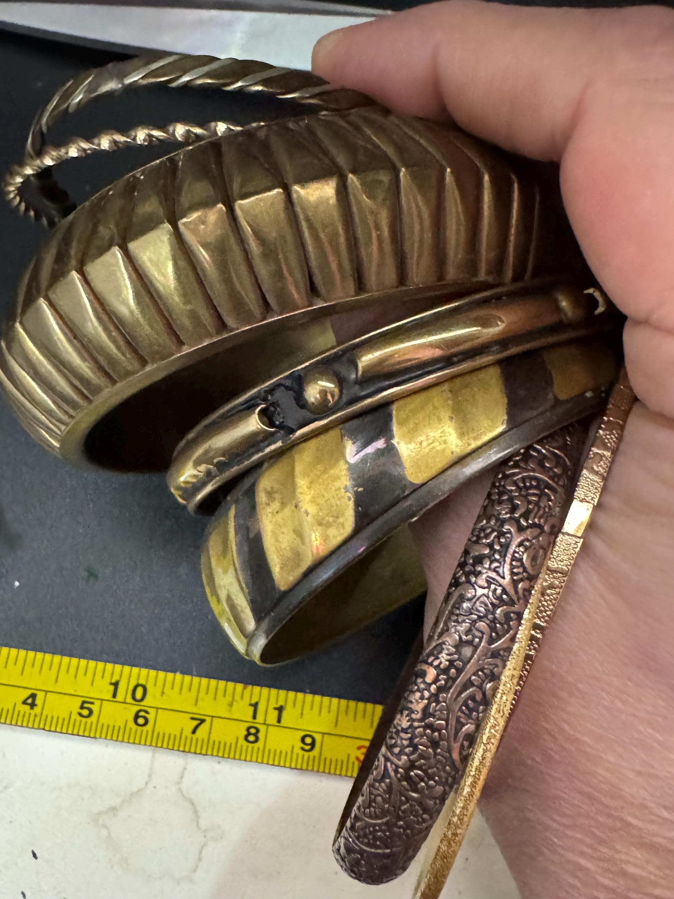 A curated set of vintage and retro gold tones stacking bangles,  boho festival bracelets