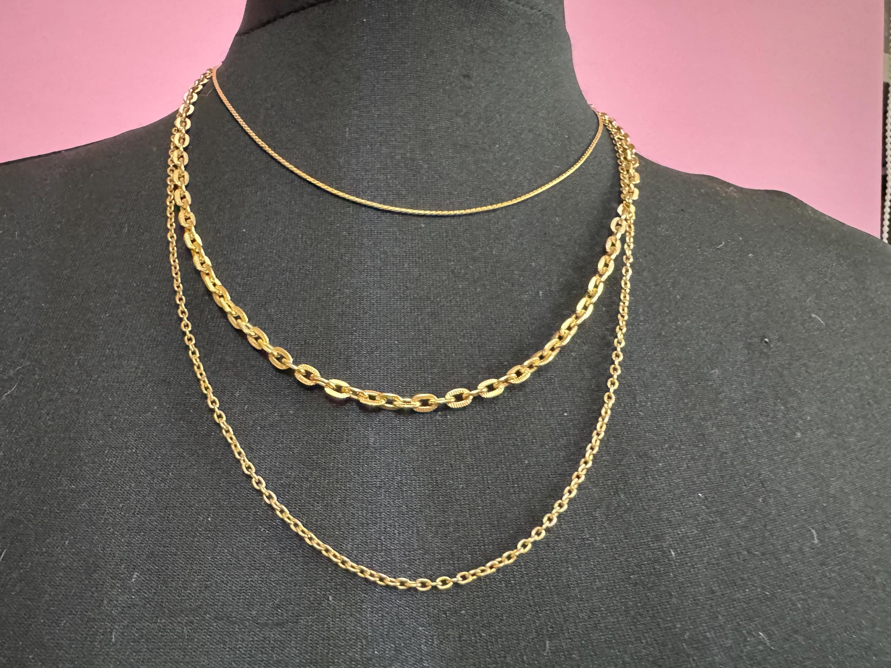 lightweight Vintage 1960s modernist gold tone multistrand drape necklace with ornate blue crystal clasp
