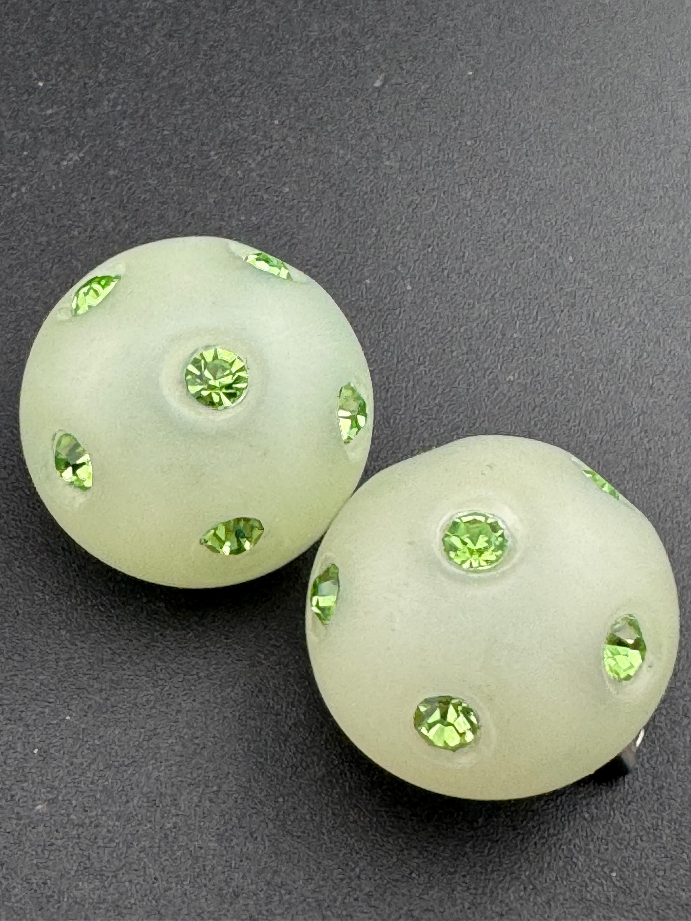 Vintage round light green rhinestone set plastic domed clip on stud earrings mid century