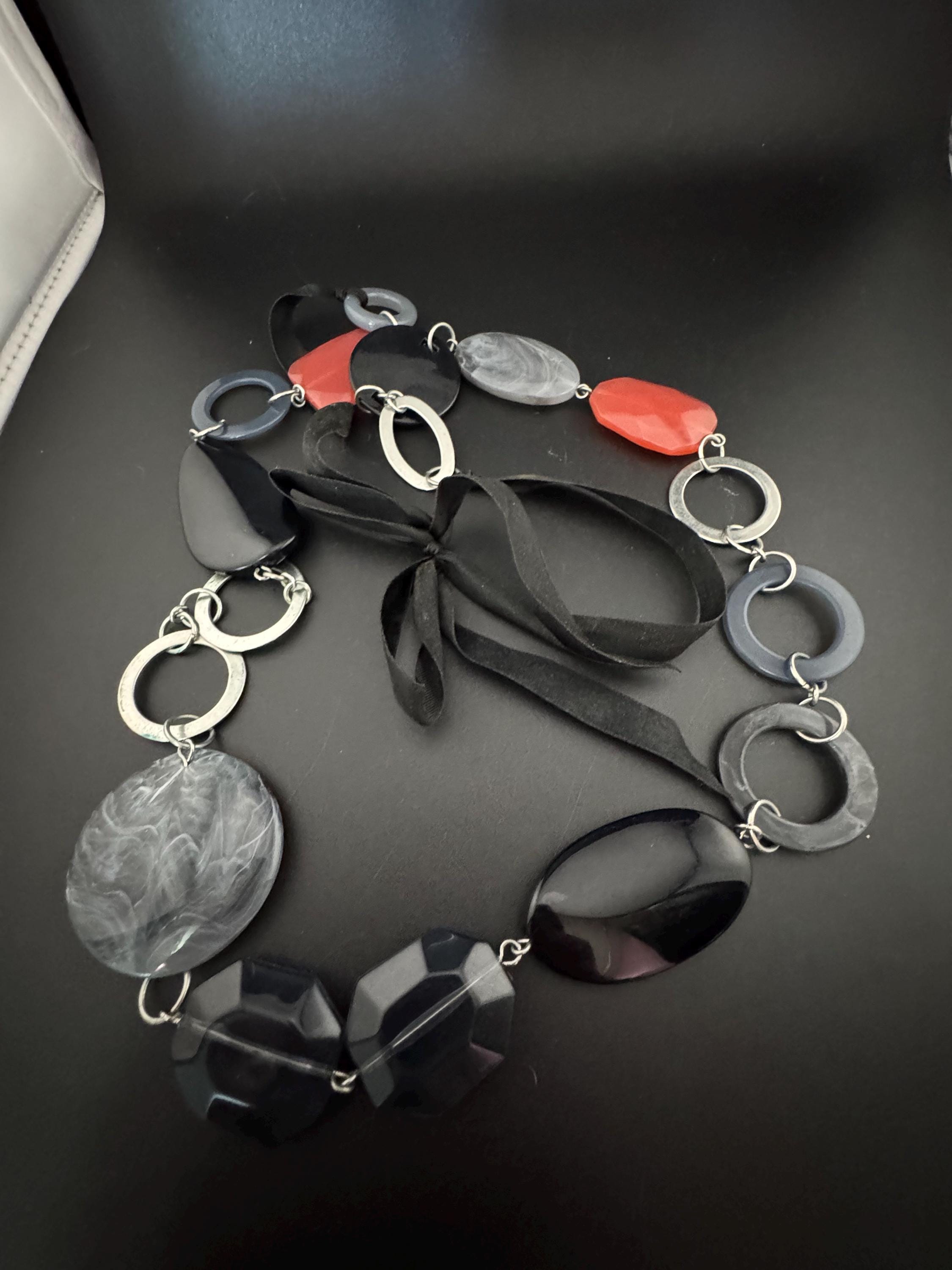 Retro long black red grey plastic abstract disc beaded station necklace 2000s on a black ribbon