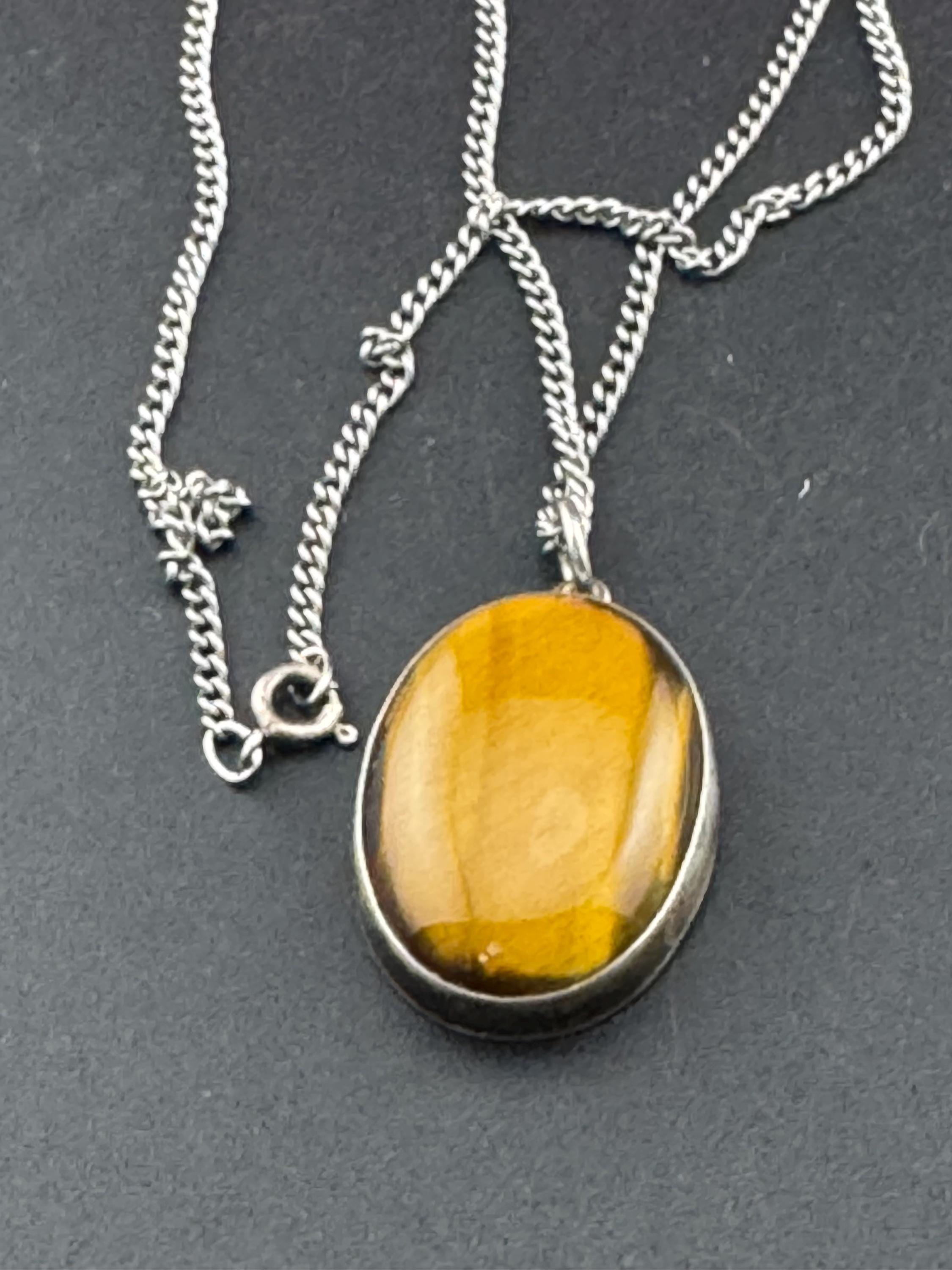 Solid silver tigerseye oval gemstone pendant necklace on 54cm chain 1970s weighs 13.7 grams