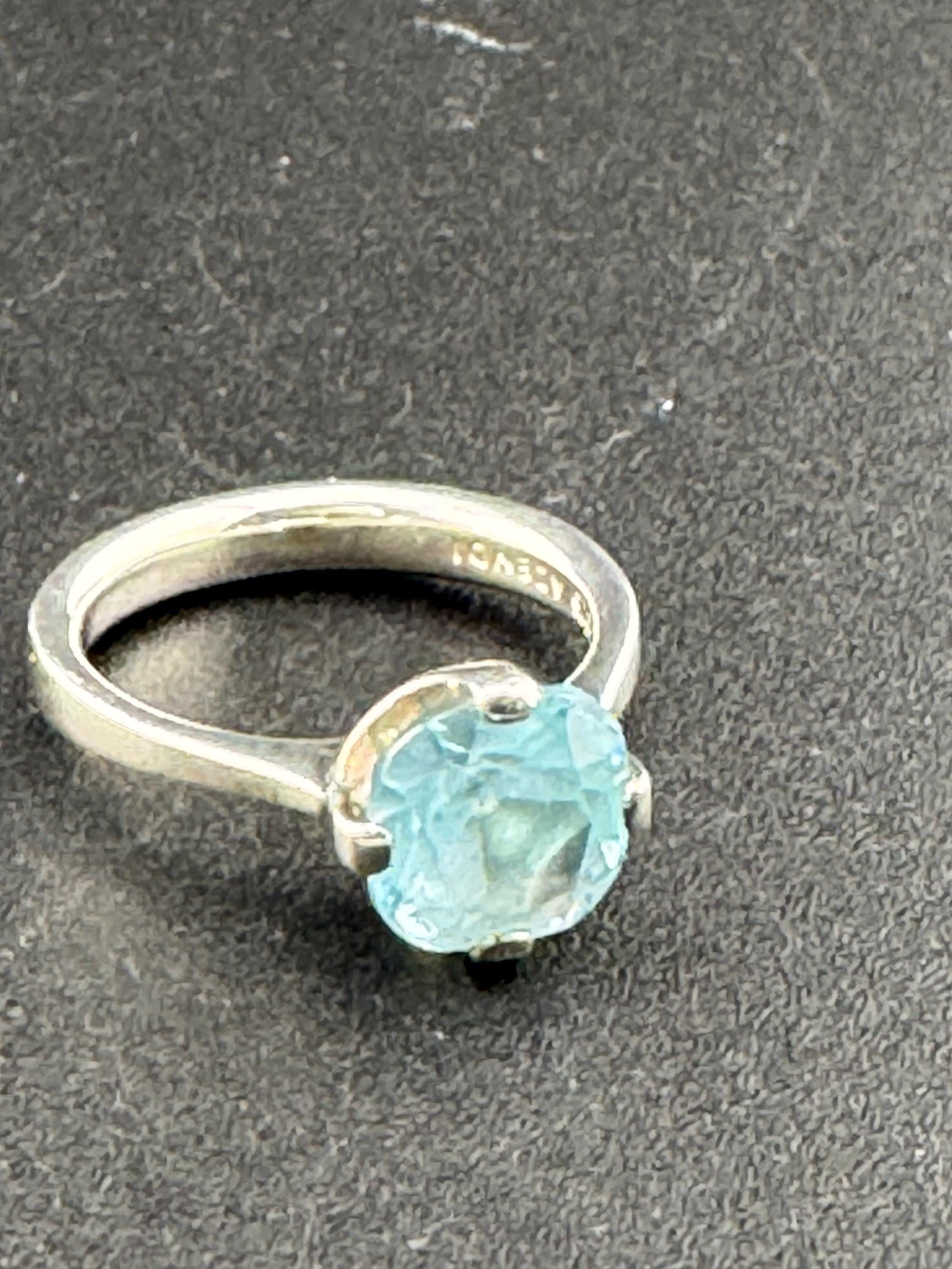 925 sterling Silver & light Blue Topaz Solitaire Ring in a Size O 1/2