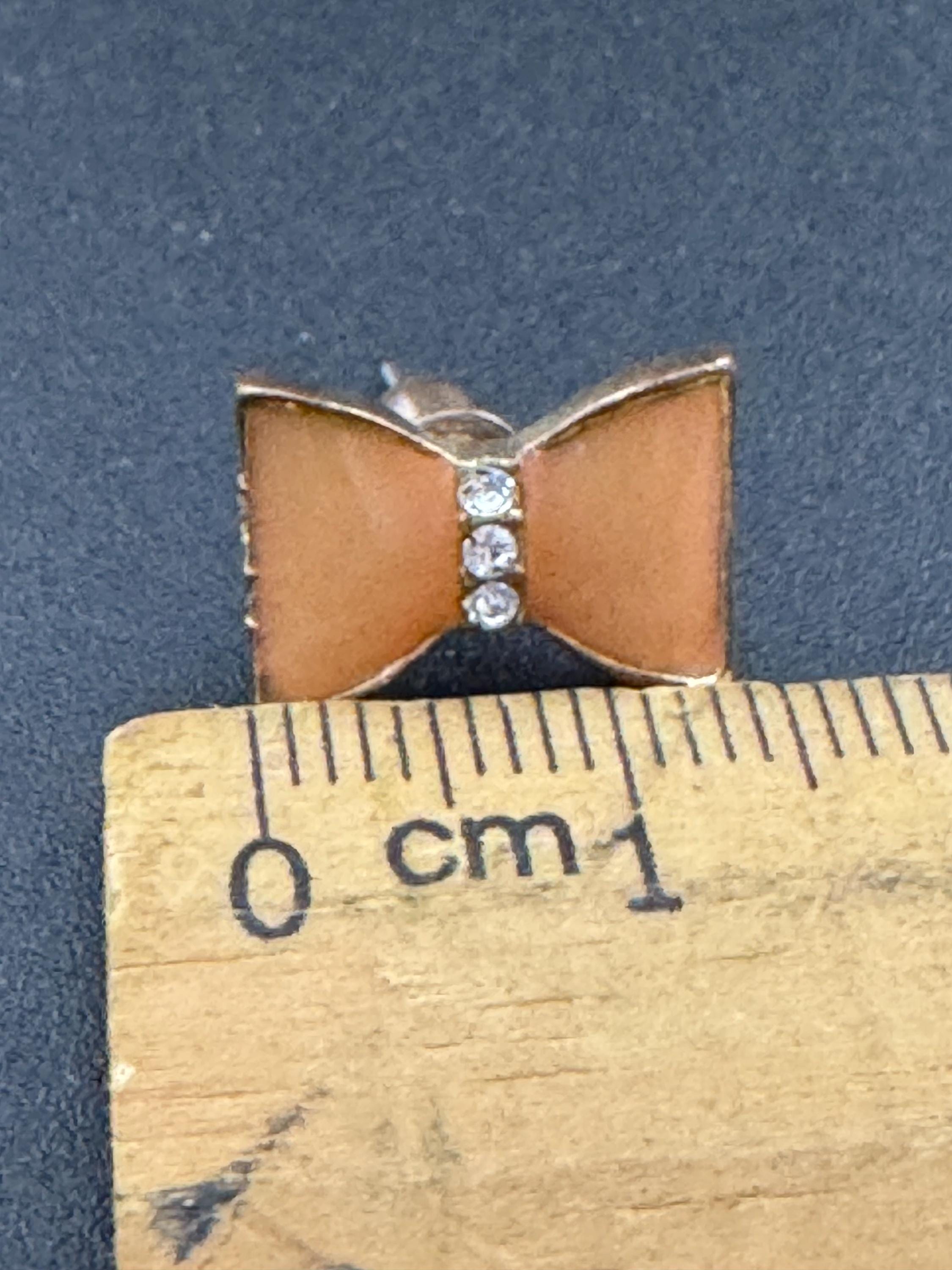 Vintage small light tangerine orange enamel gold tone crystal bow stud earrings for pierced ears