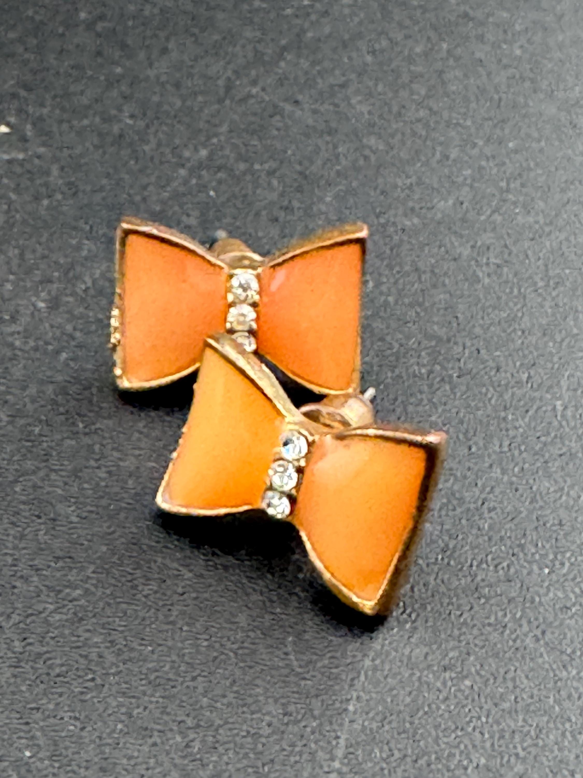 Vintage small light tangerine orange enamel gold tone crystal bow stud earrings for pierced ears