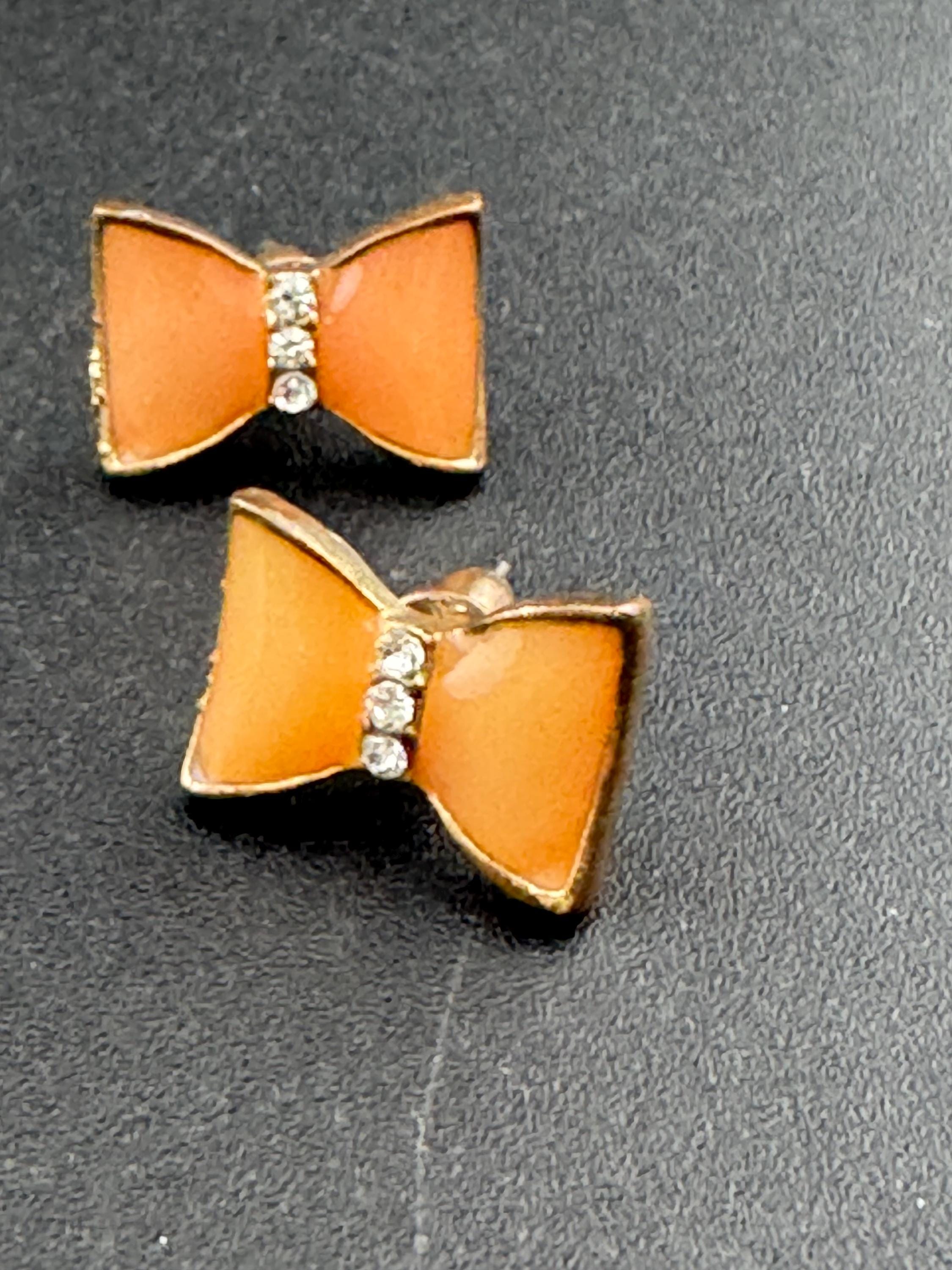 Vintage small light tangerine orange enamel gold tone crystal bow stud earrings for pierced ears