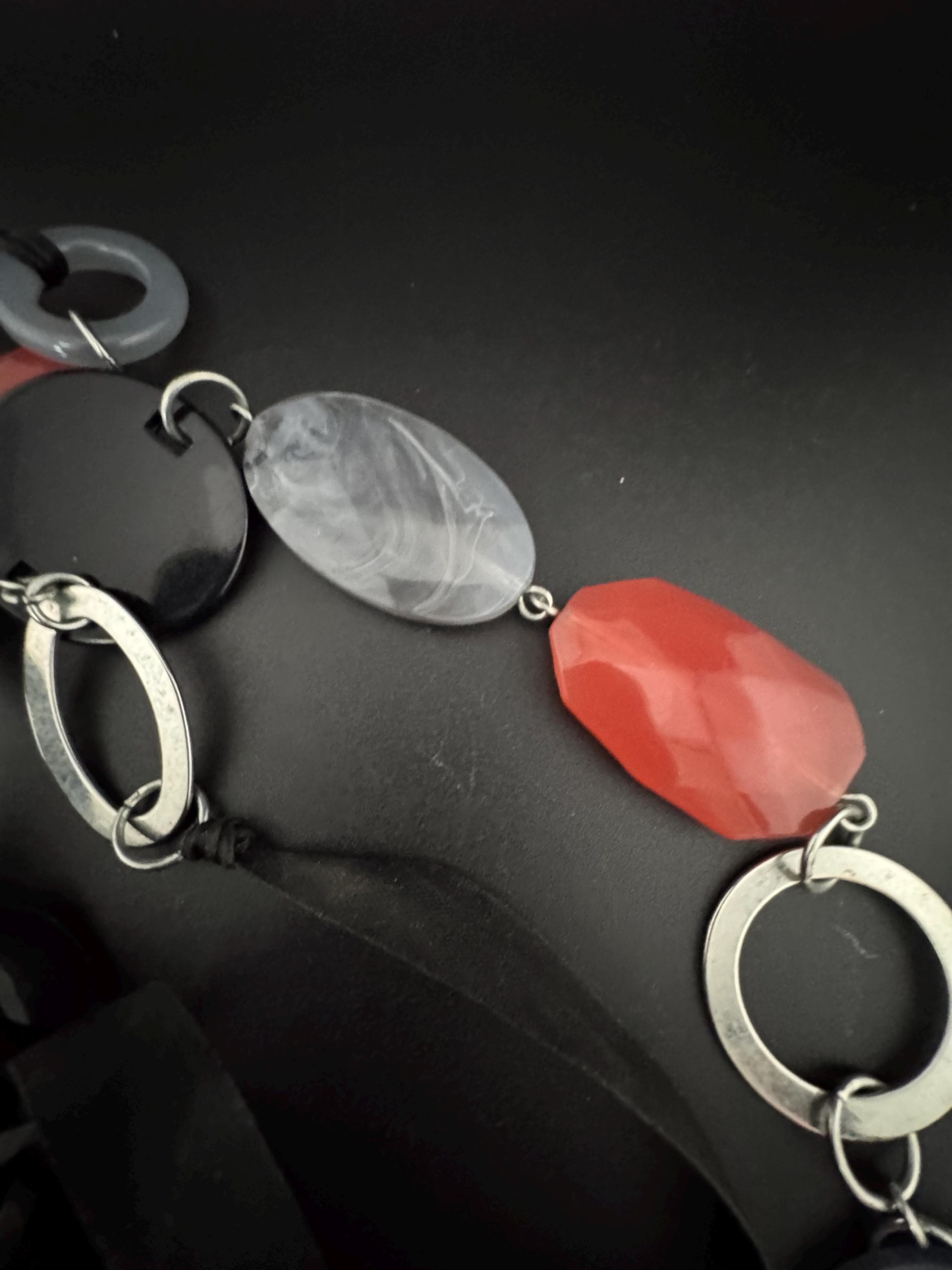 Retro long black red grey plastic abstract disc beaded station necklace 2000s on a black ribbon