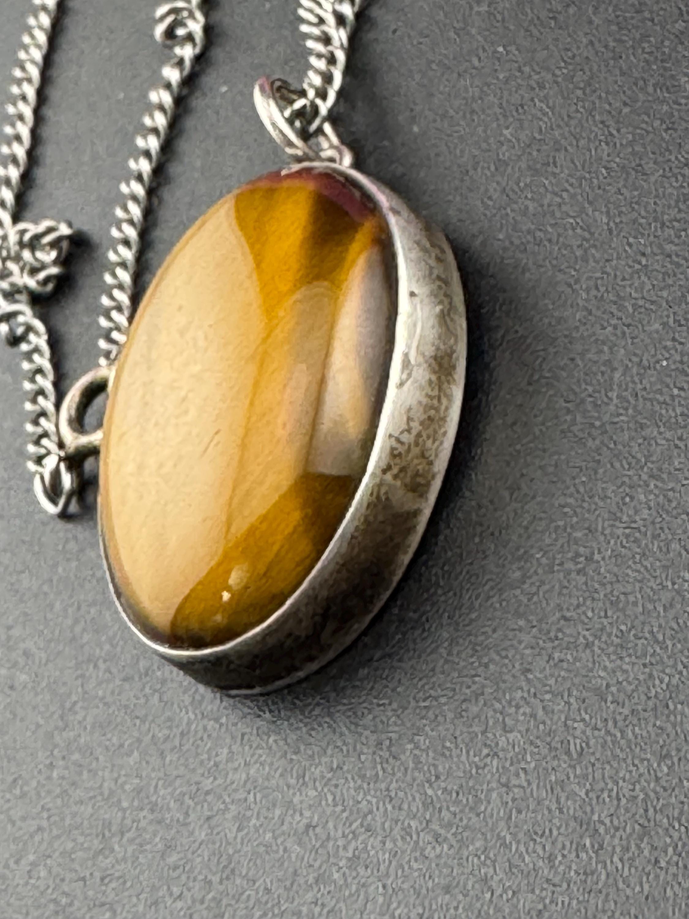 Solid silver tigerseye oval gemstone pendant necklace on 54cm chain 1970s weighs 13.7 grams