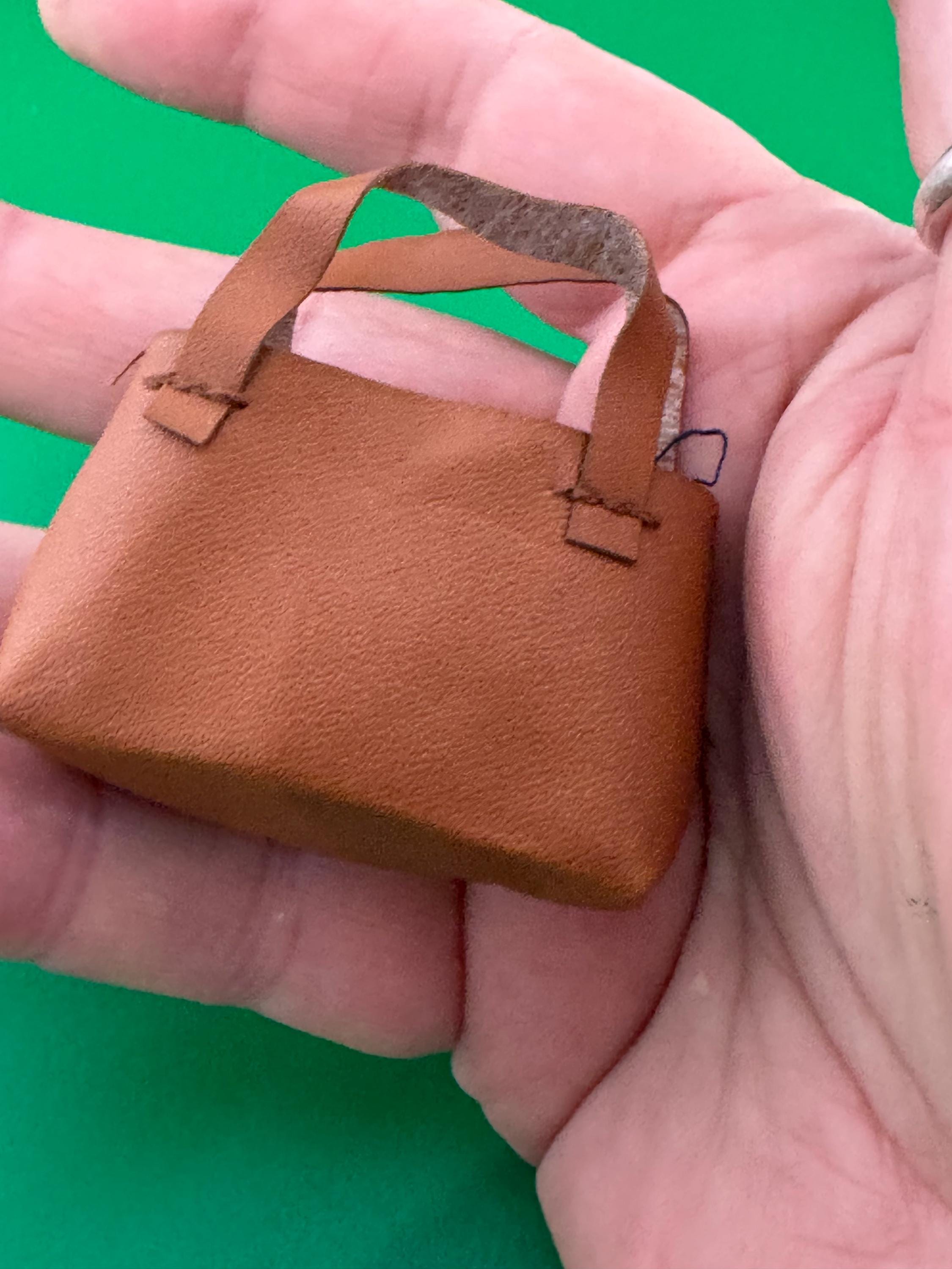 miniature brown tote handbag cake topper decoration for a dolls cake