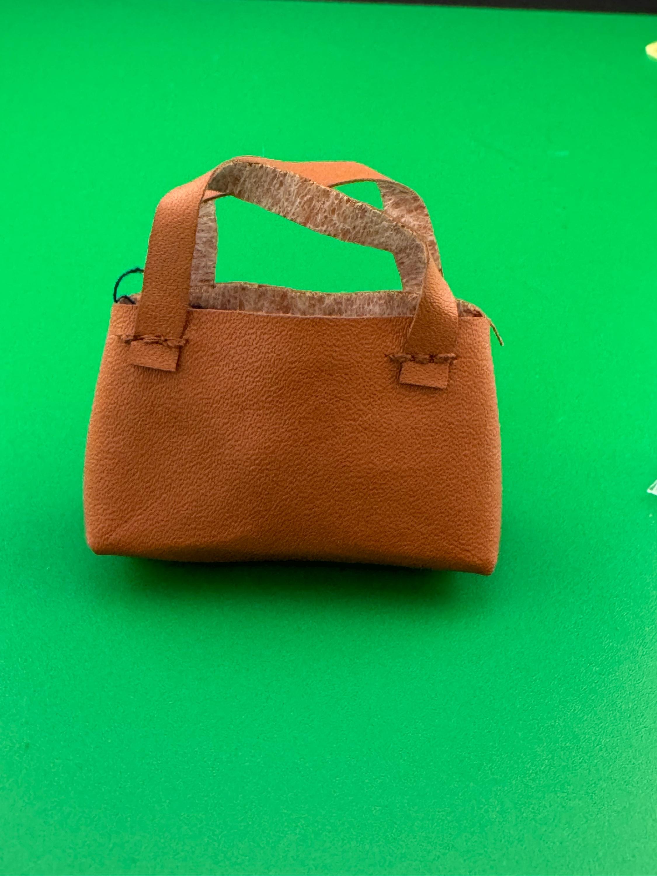miniature brown tote handbag cake topper decoration for a dolls cake