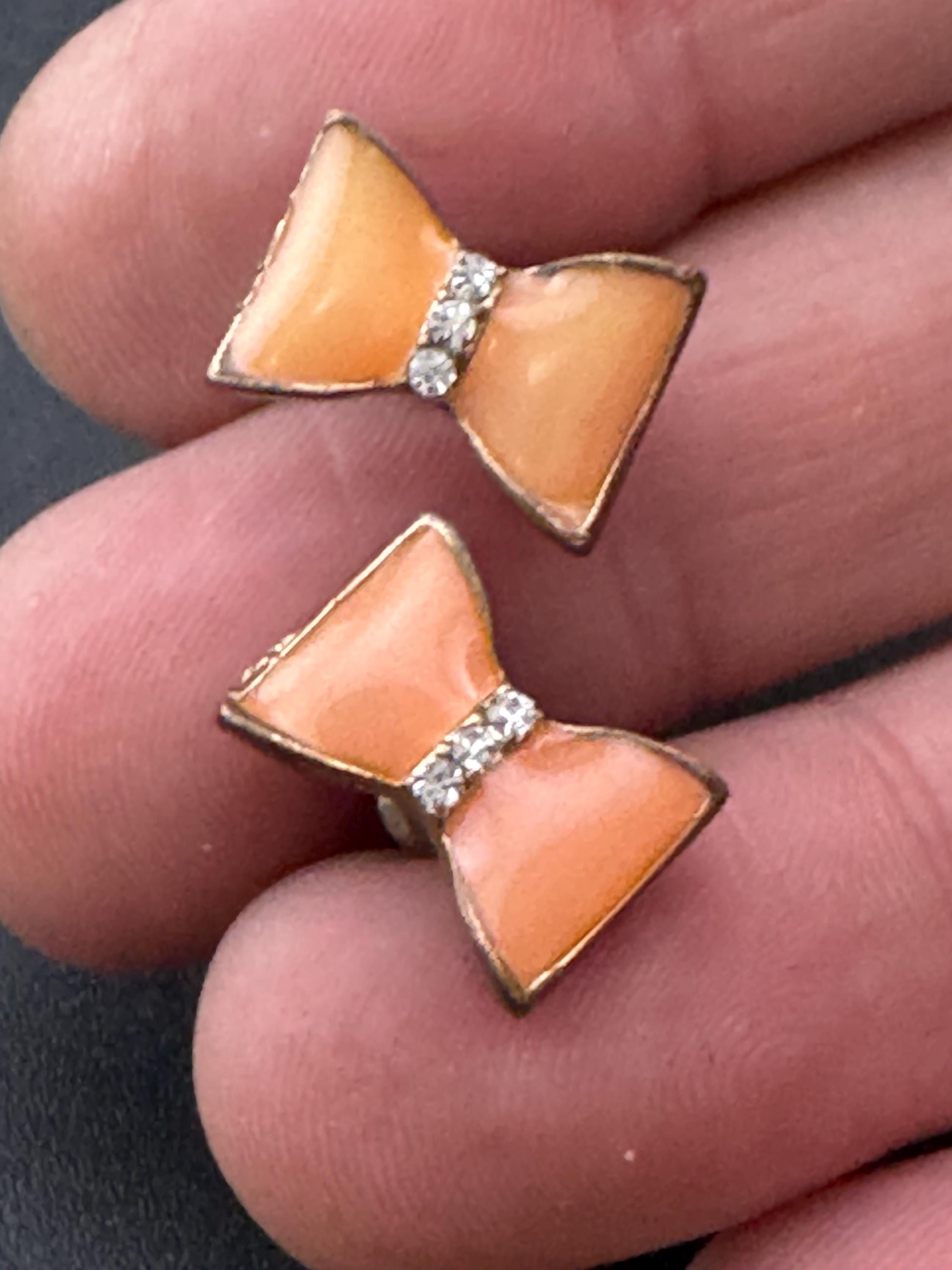 Vintage small light tangerine orange enamel gold tone crystal bow stud earrings for pierced ears