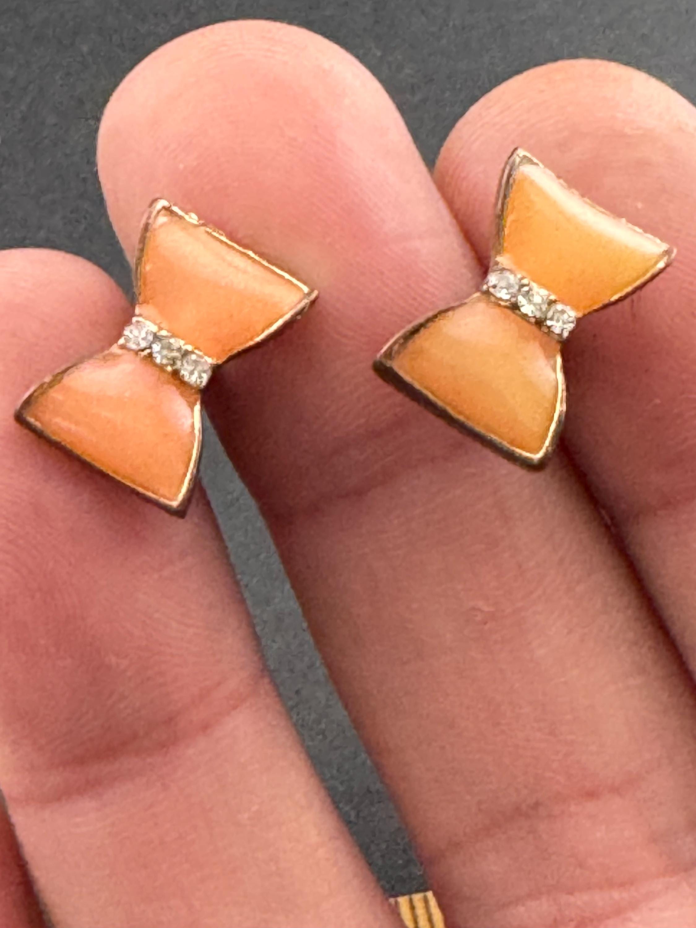 Vintage small light tangerine orange enamel gold tone crystal bow stud earrings for pierced ears