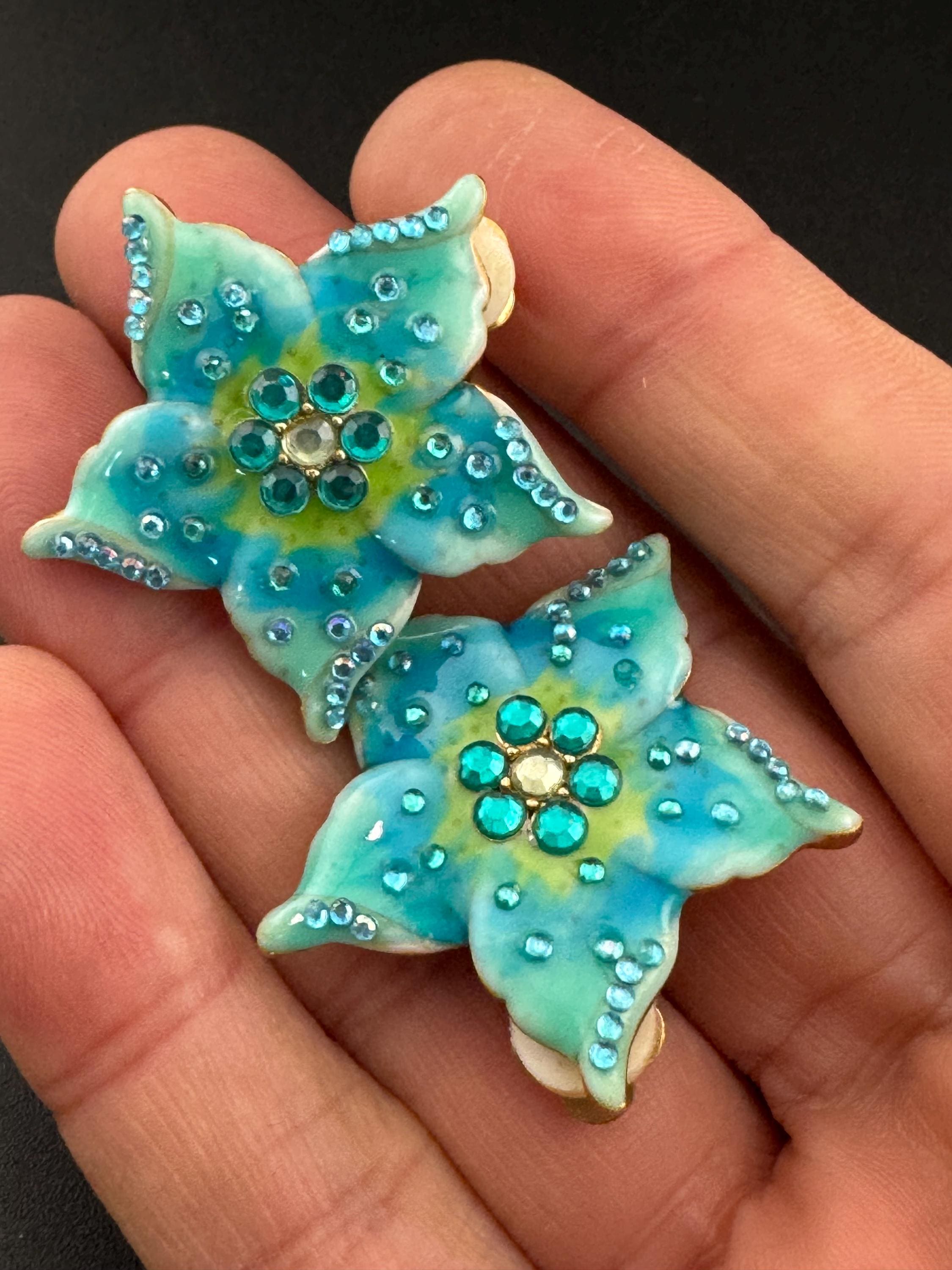 Stamped star emblem vintage turquoise Blue enamel and crystal gold tone flower Clip on earrings