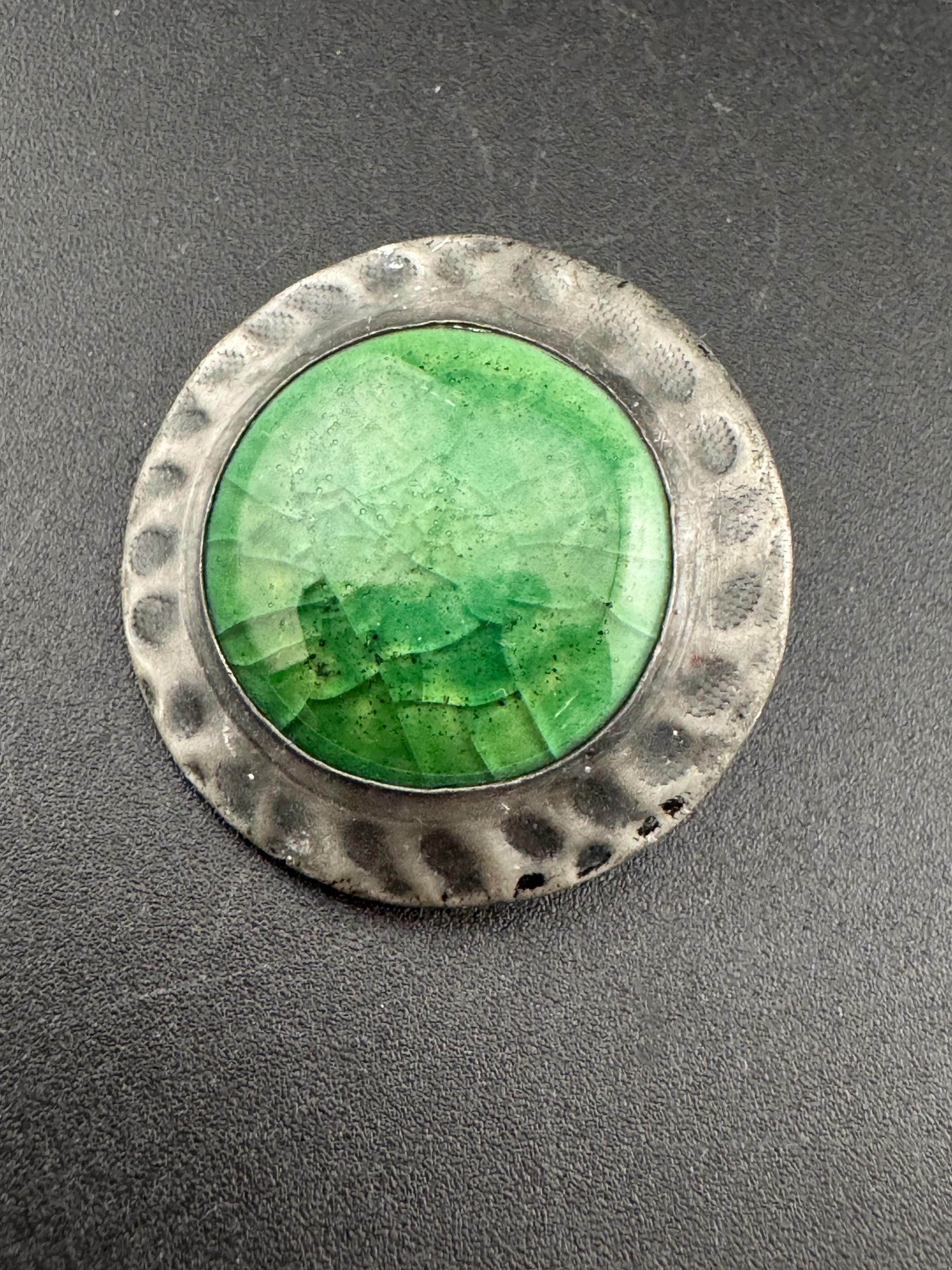 Antique arts and crafts period beaten metal brooch green cabochon in art nouveau