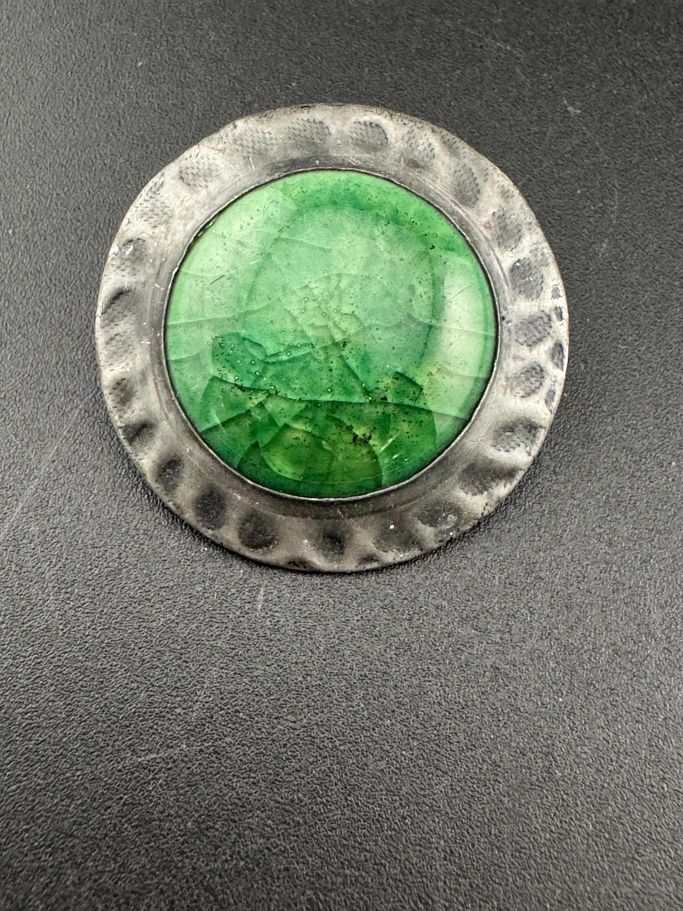 Antique arts and crafts period beaten metal brooch green cabochon in art nouveau