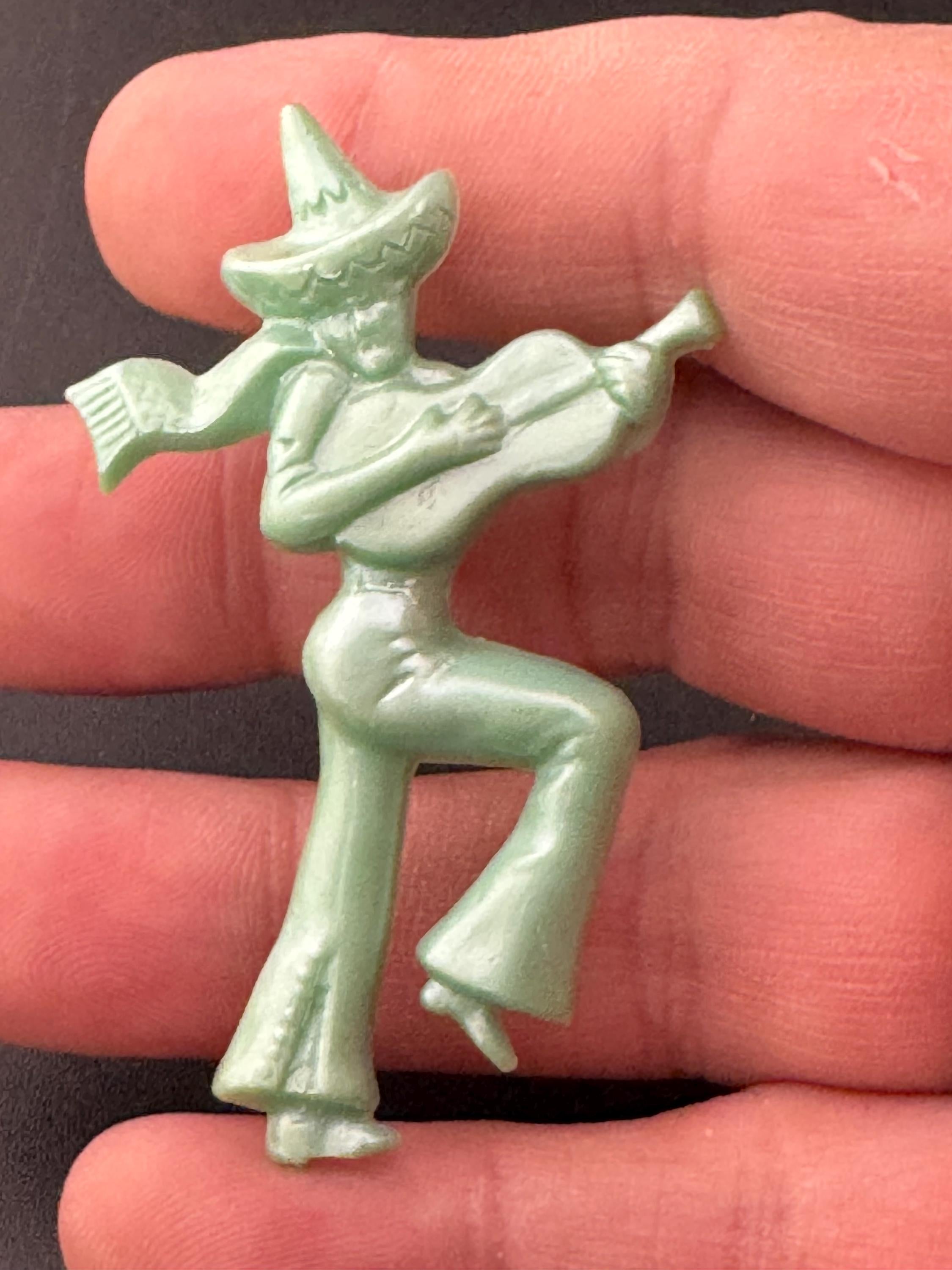 Vintage early Plastic Celluloid Spanish man playing the guitar brooch super kitsch