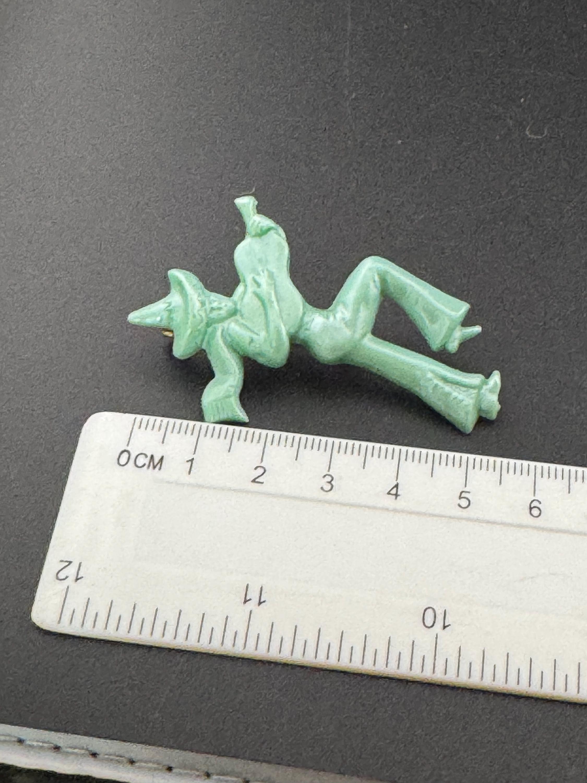 Vintage early Plastic Celluloid Spanish man playing the guitar brooch super kitsch