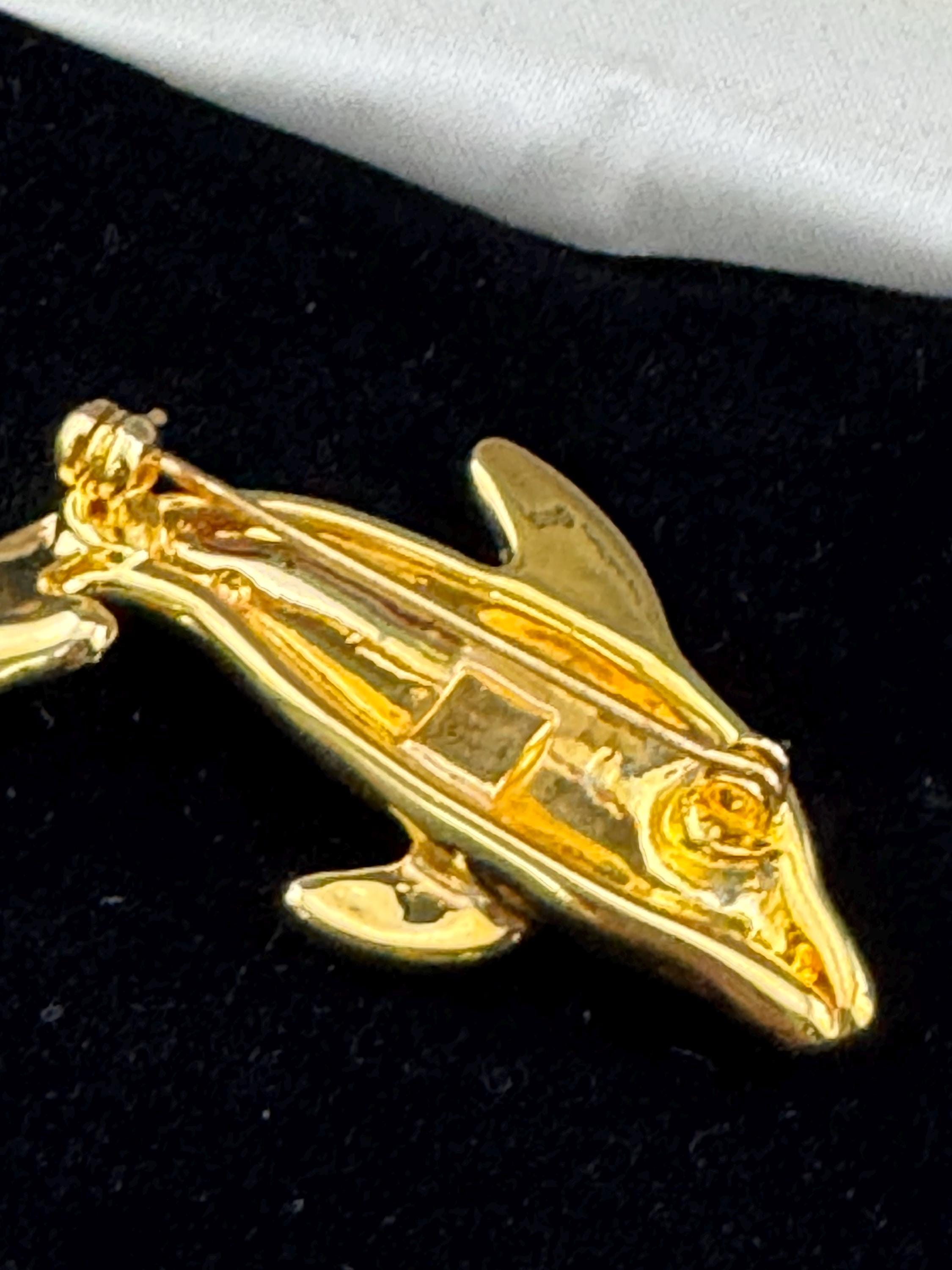 Boxed signed Pierre Cardin gold plated crystal diamanté dolphin brooch