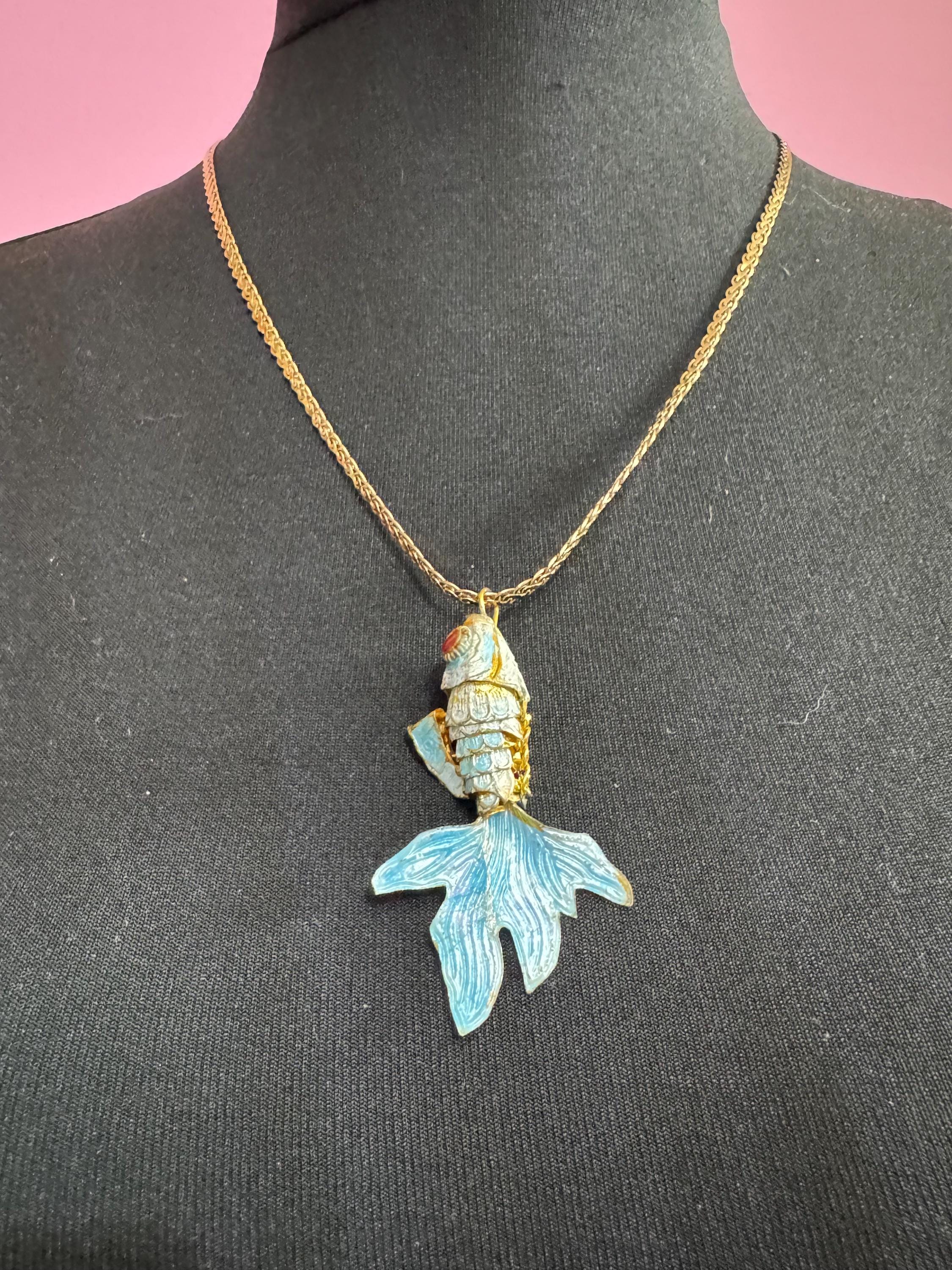Vintage blue enamel articulated gold fish pendant on a 75 gold plated serpentine chain