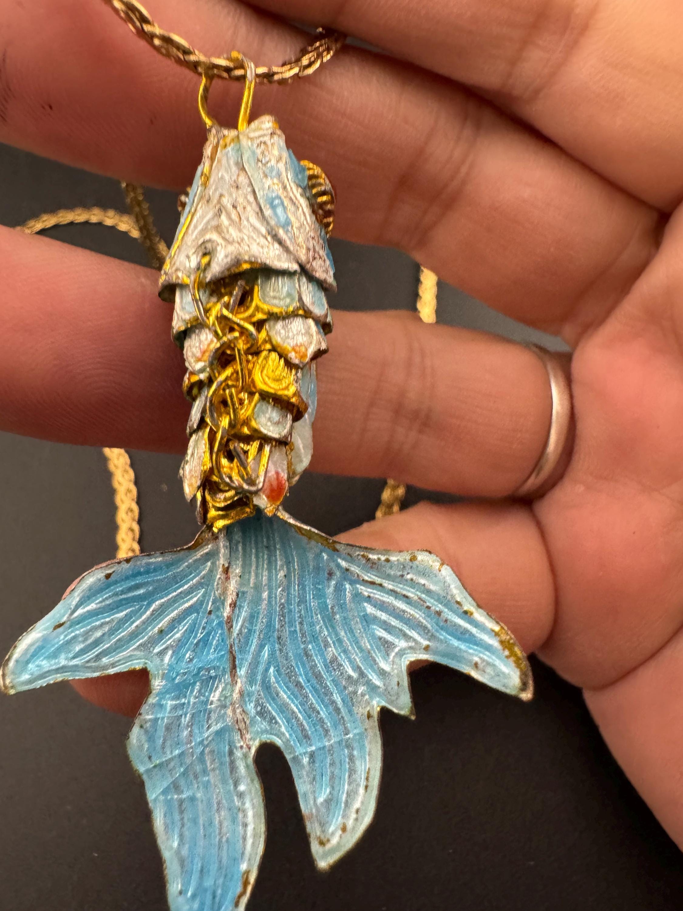 Vintage blue enamel articulated gold fish pendant on a 75 gold plated serpentine chain