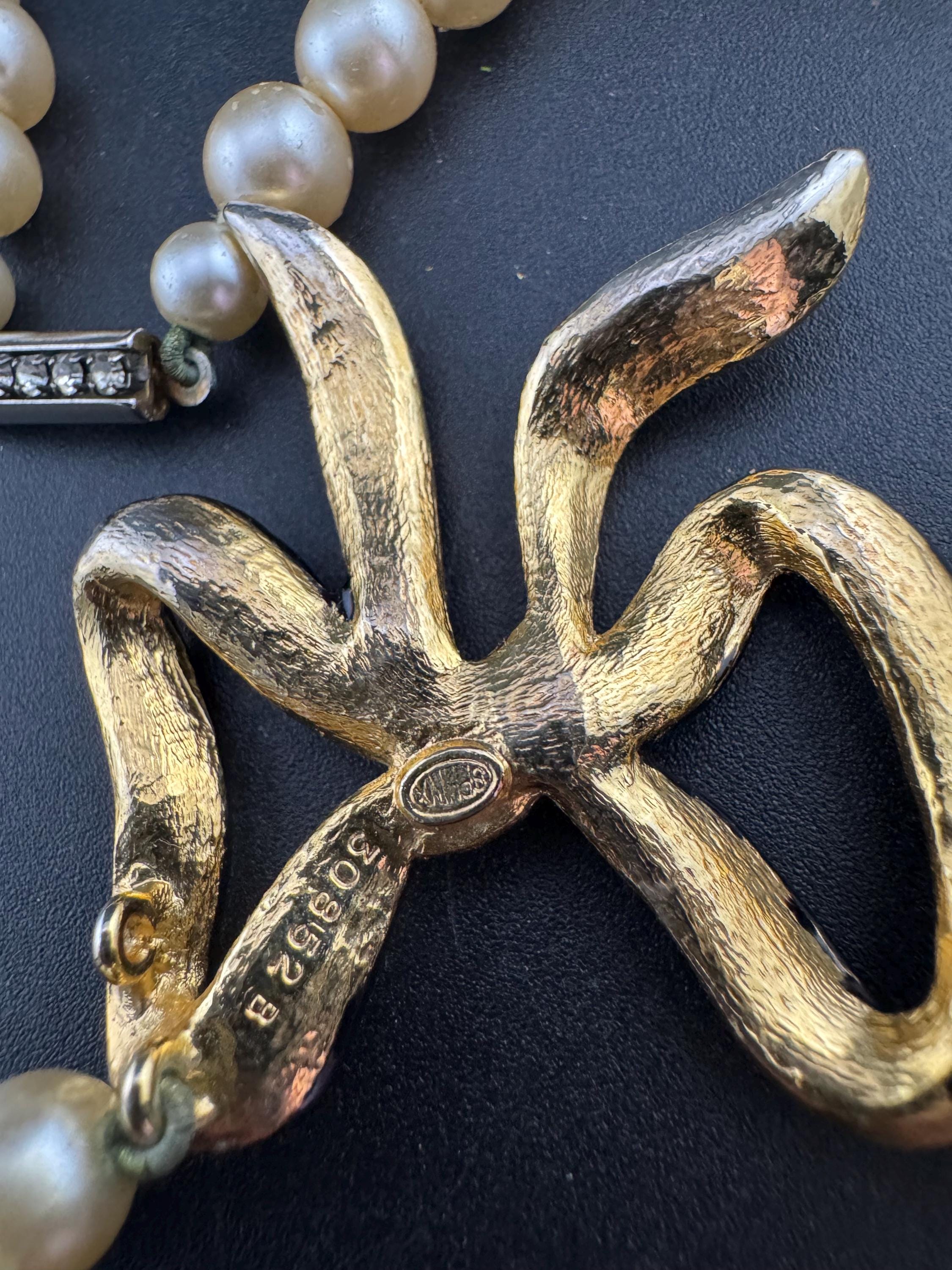 Signed Sphinx cream glass beaded diamanté necklace with classic black ribbon bow detail