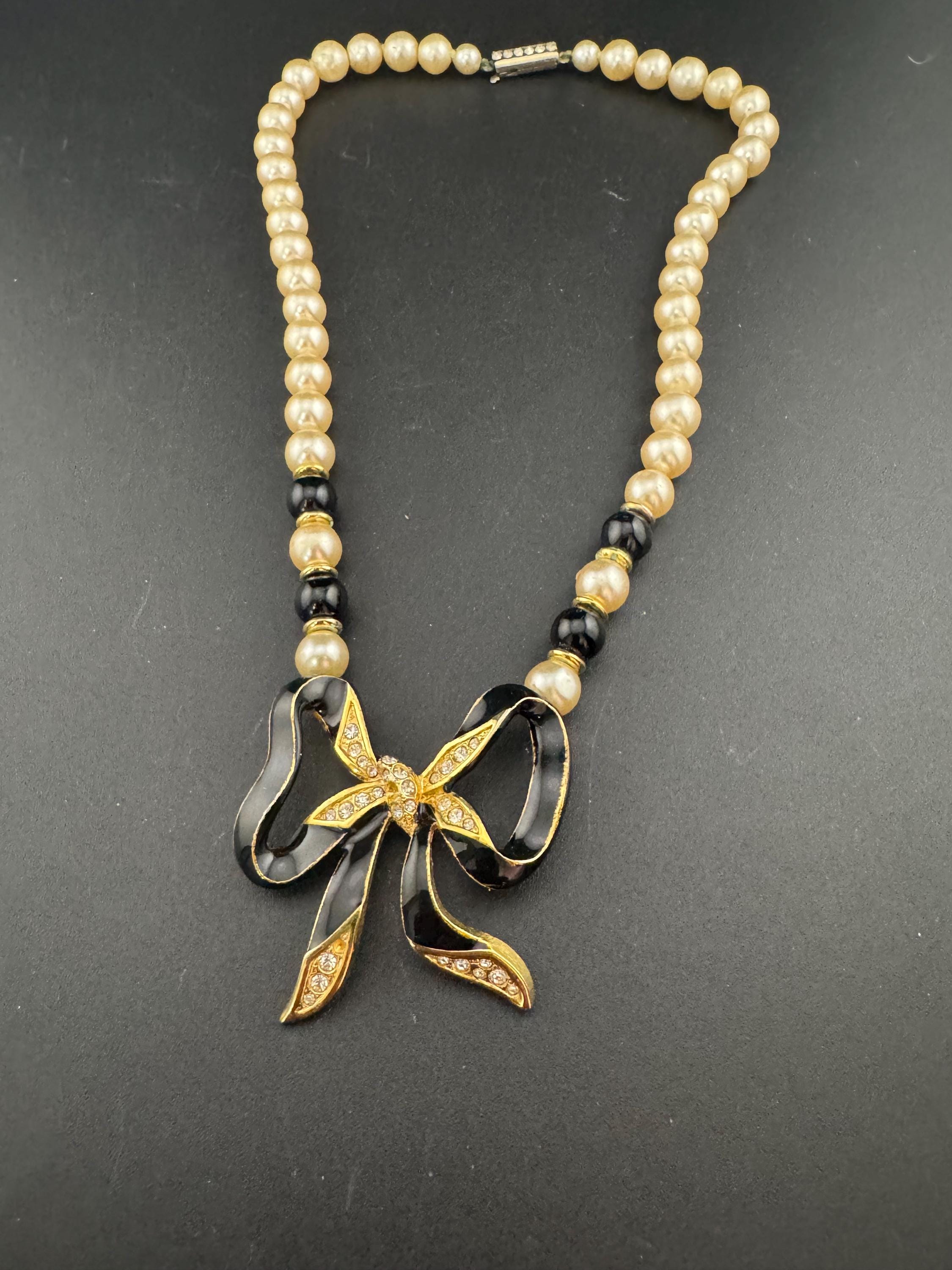 Signed Sphinx cream glass beaded diamanté necklace with classic black ribbon bow detail