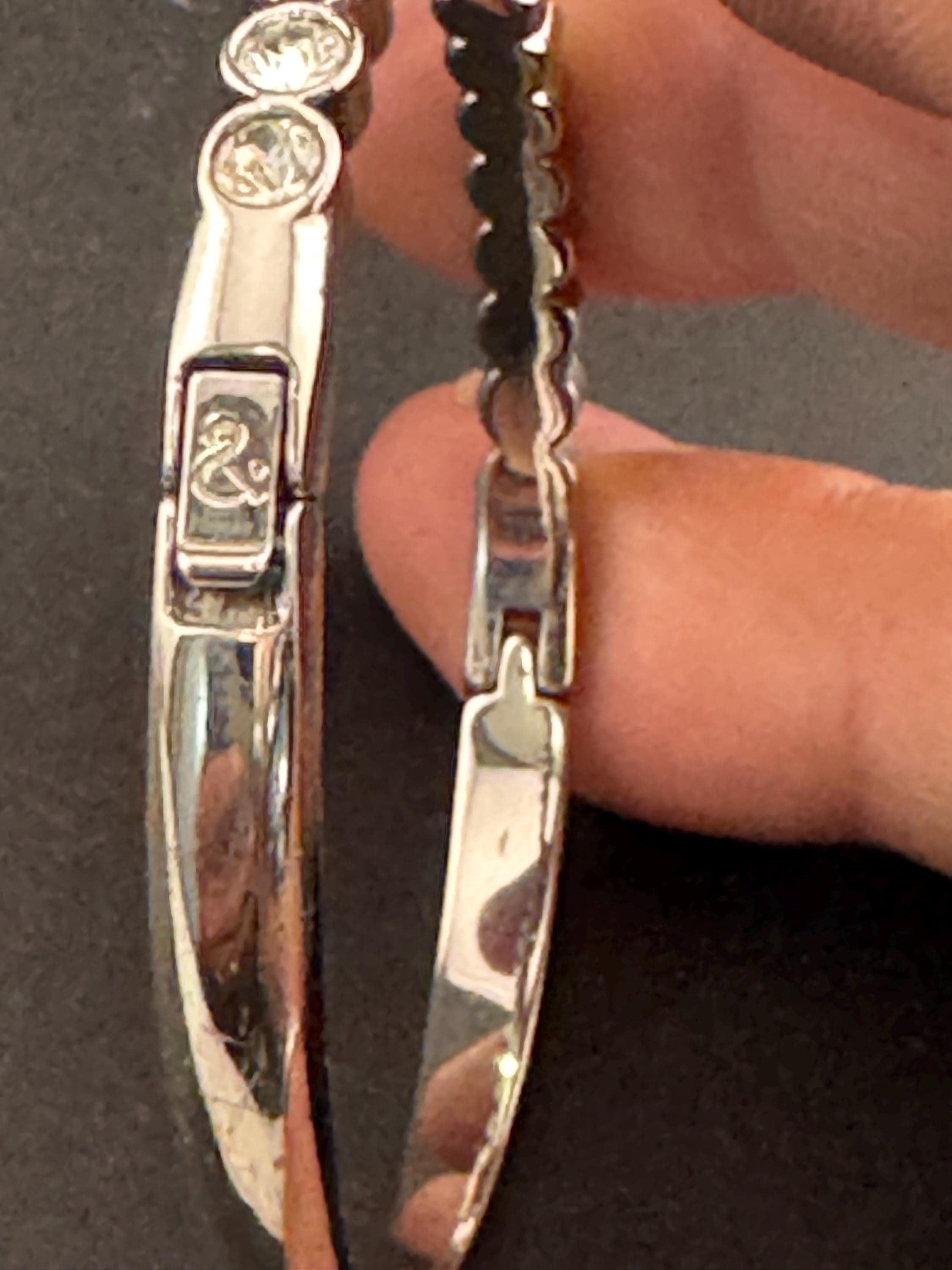 Vintage slim silver tone hinged bangle bracelet with clear glass bezel set rhinestones crystals, signed