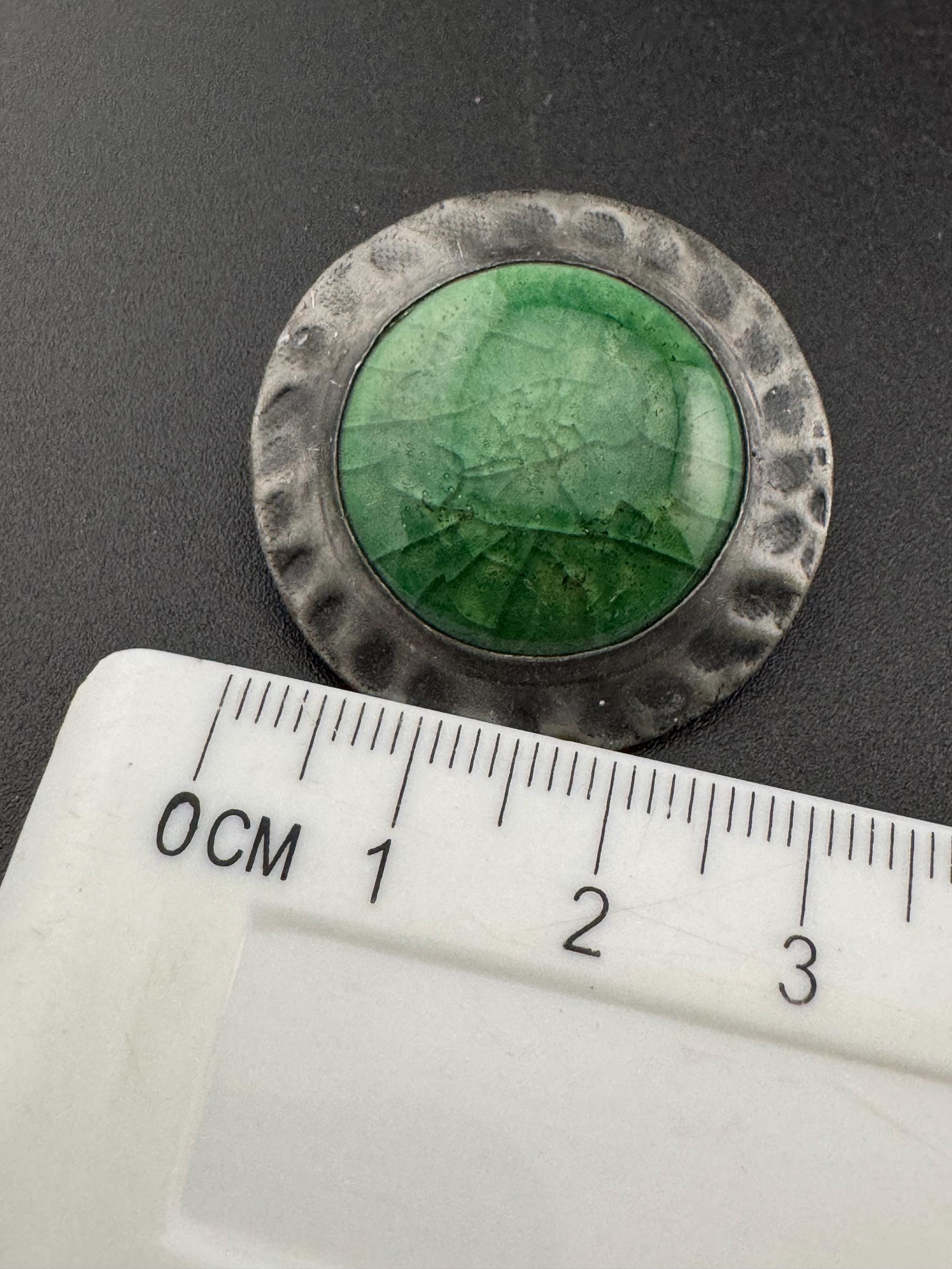 Antique arts and crafts period beaten metal brooch green cabochon in art nouveau