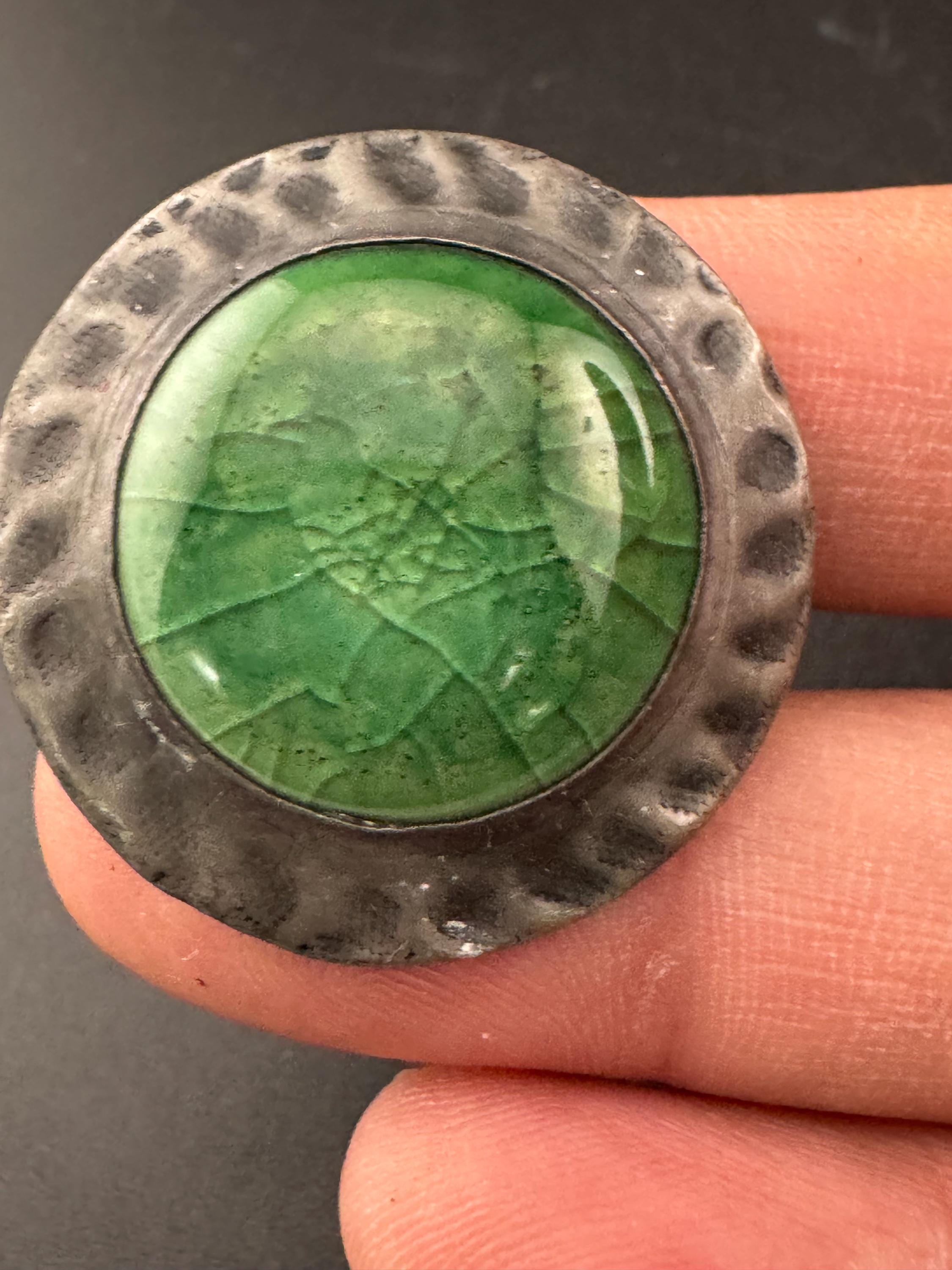 Antique arts and crafts period beaten metal brooch green cabochon in art nouveau