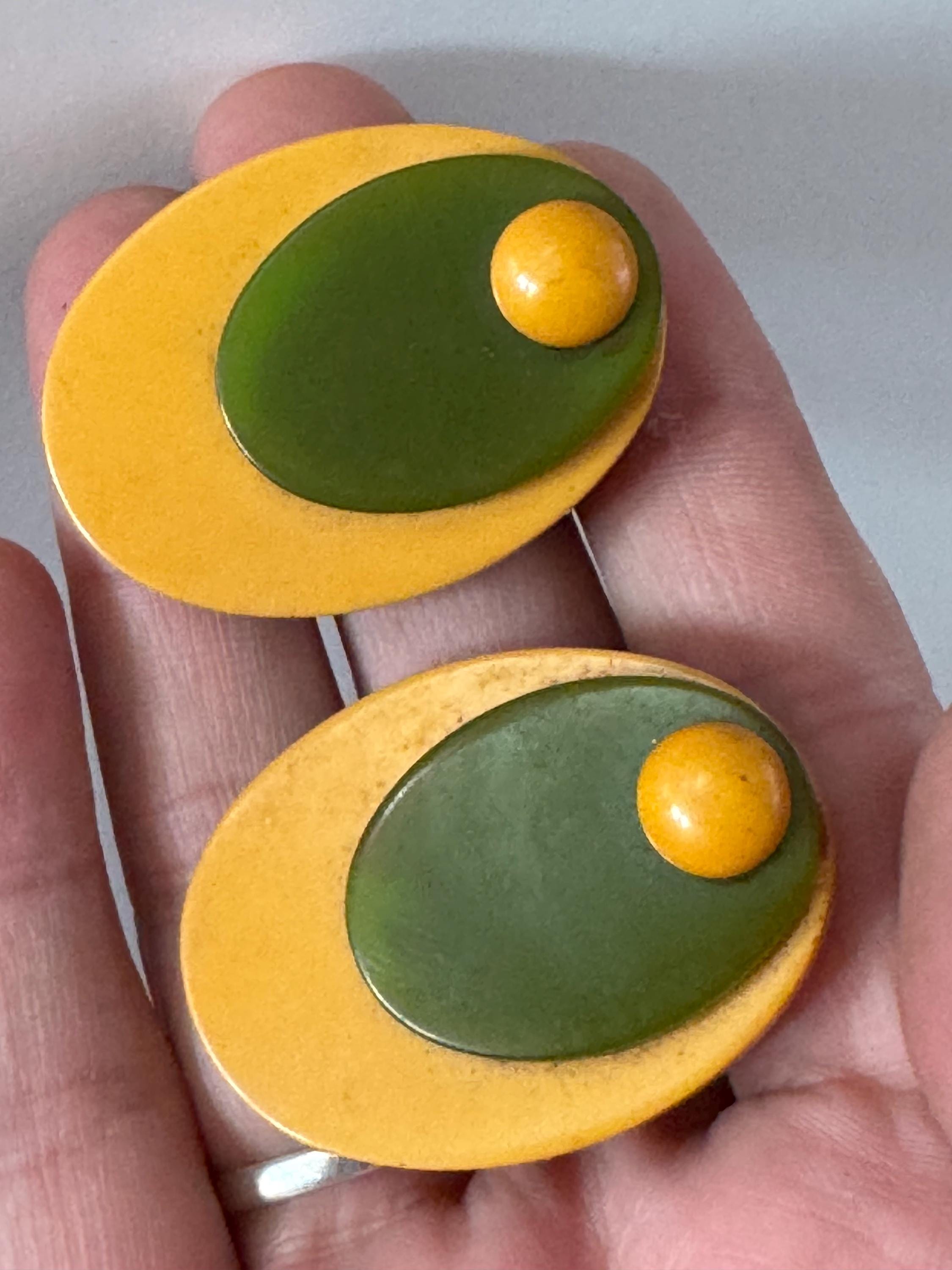 Antique Vintage pair of french early plastic or Bakelite galalith  mustard yellow and olive green oval dress clips