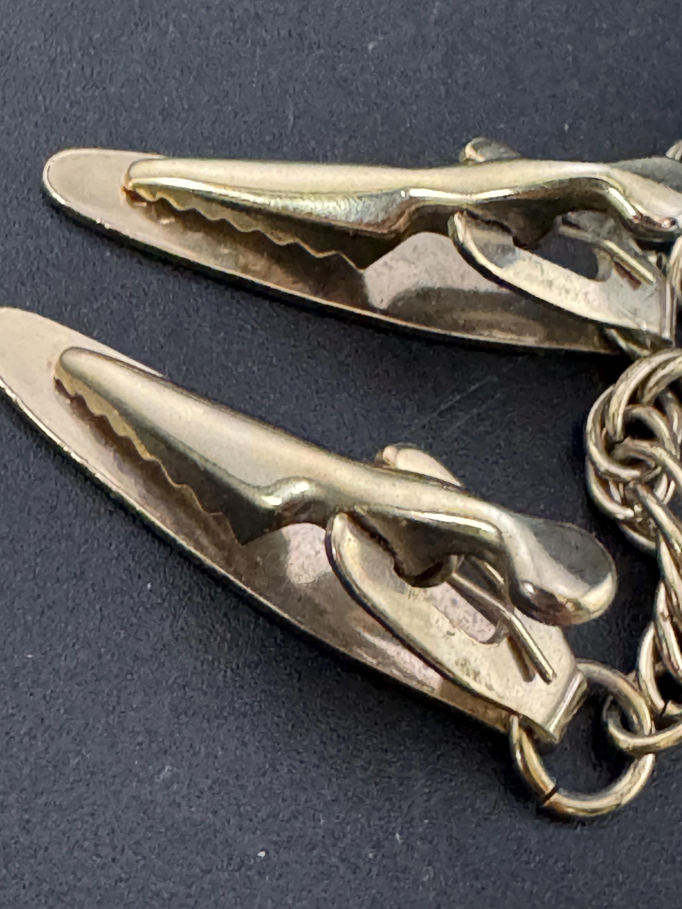 vintage double gold tone oval panel metal sweater guards jumper clips