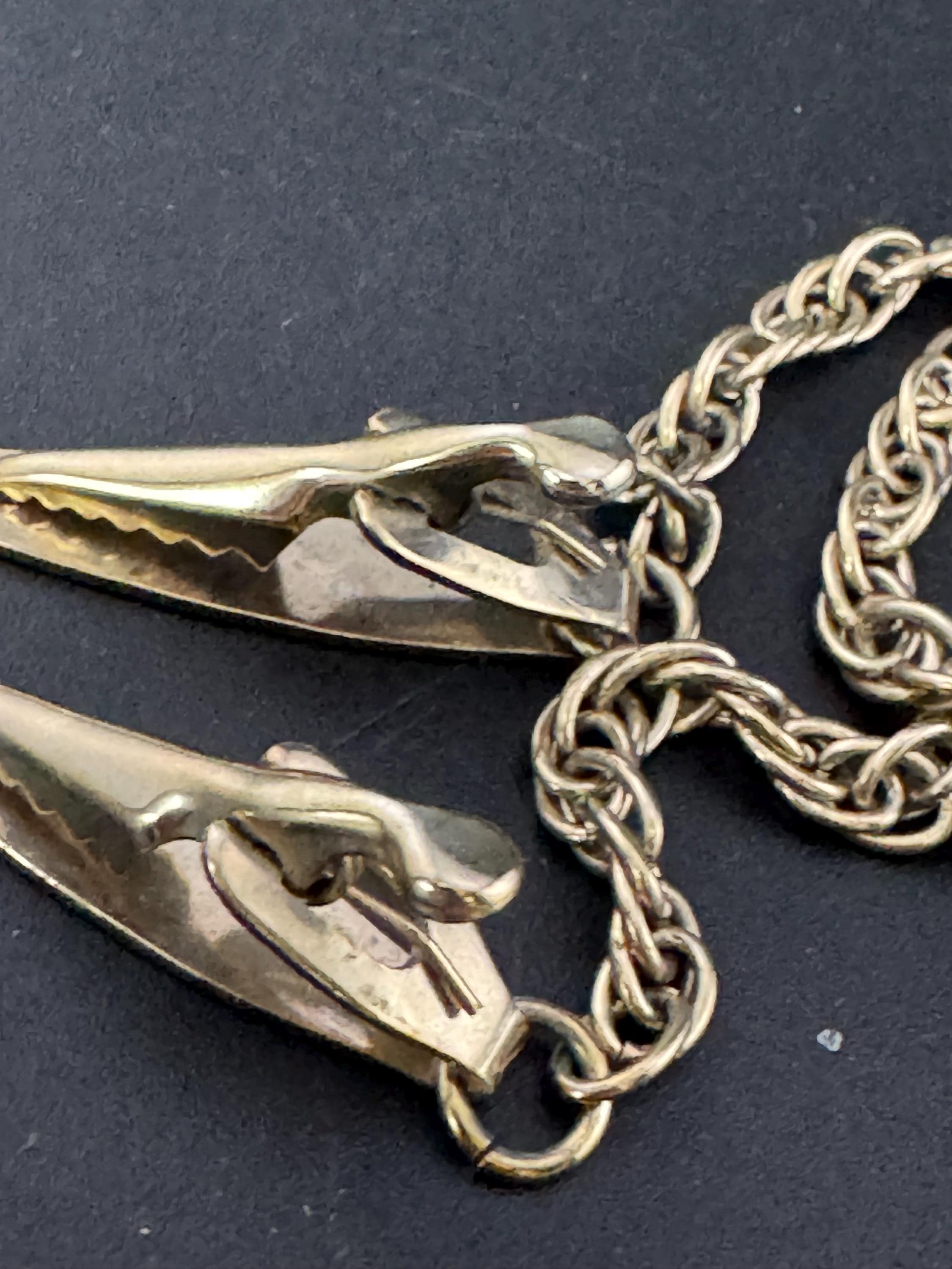 vintage double gold tone oval panel metal sweater guards jumper clips