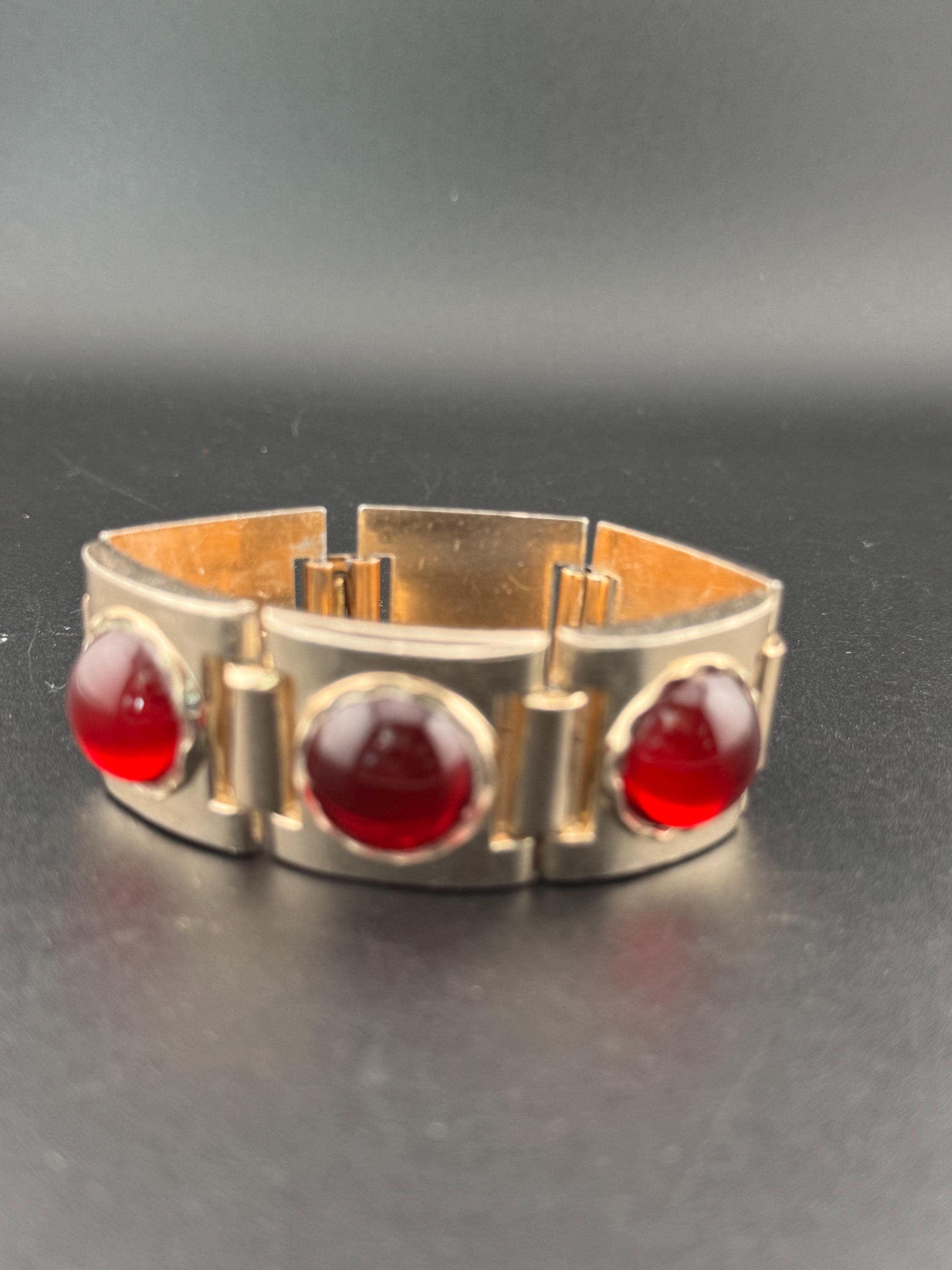 Vintage bright ruby red round Glass Cabochon warm copper Gold Tone statement chunky panel link cocktail bracelet Hollywood 1950s 1960s
