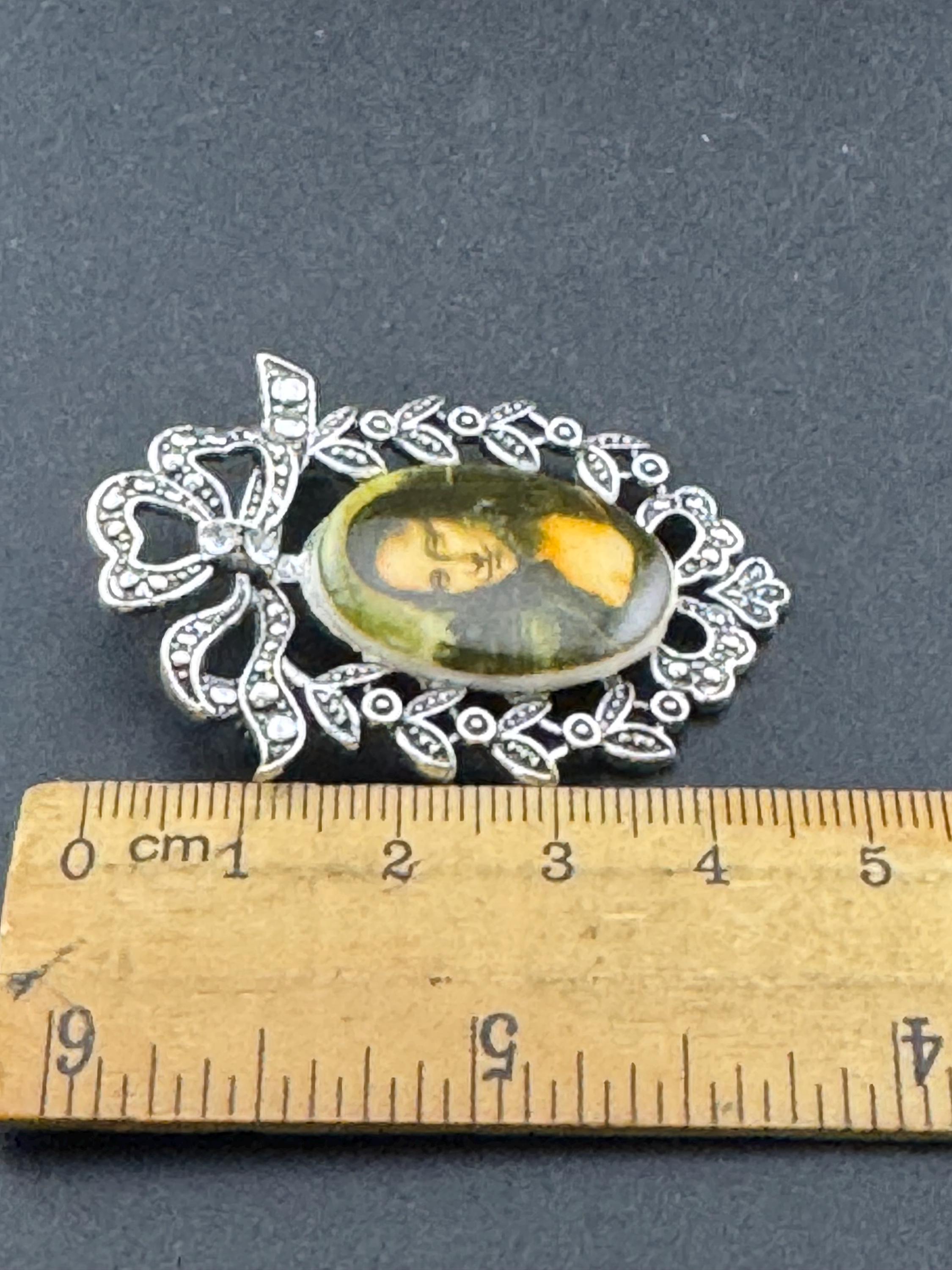 Vintage style handmade MONA LISA brooch with antique silver tone ornate frame using vintage ceramic German cabochons