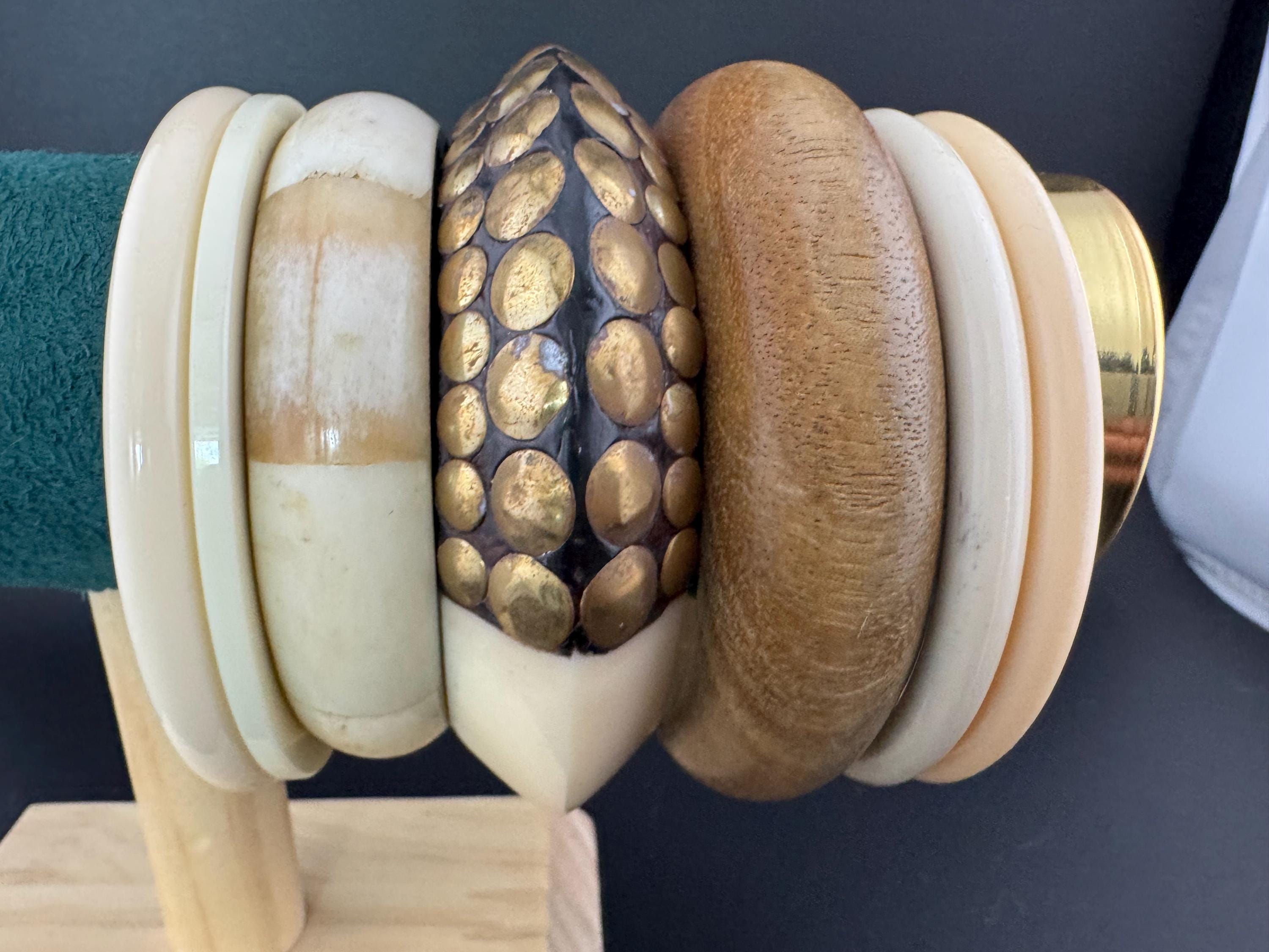 A curated stack of Cream brown beige neutrals vintage and retro plastic wooden bangles