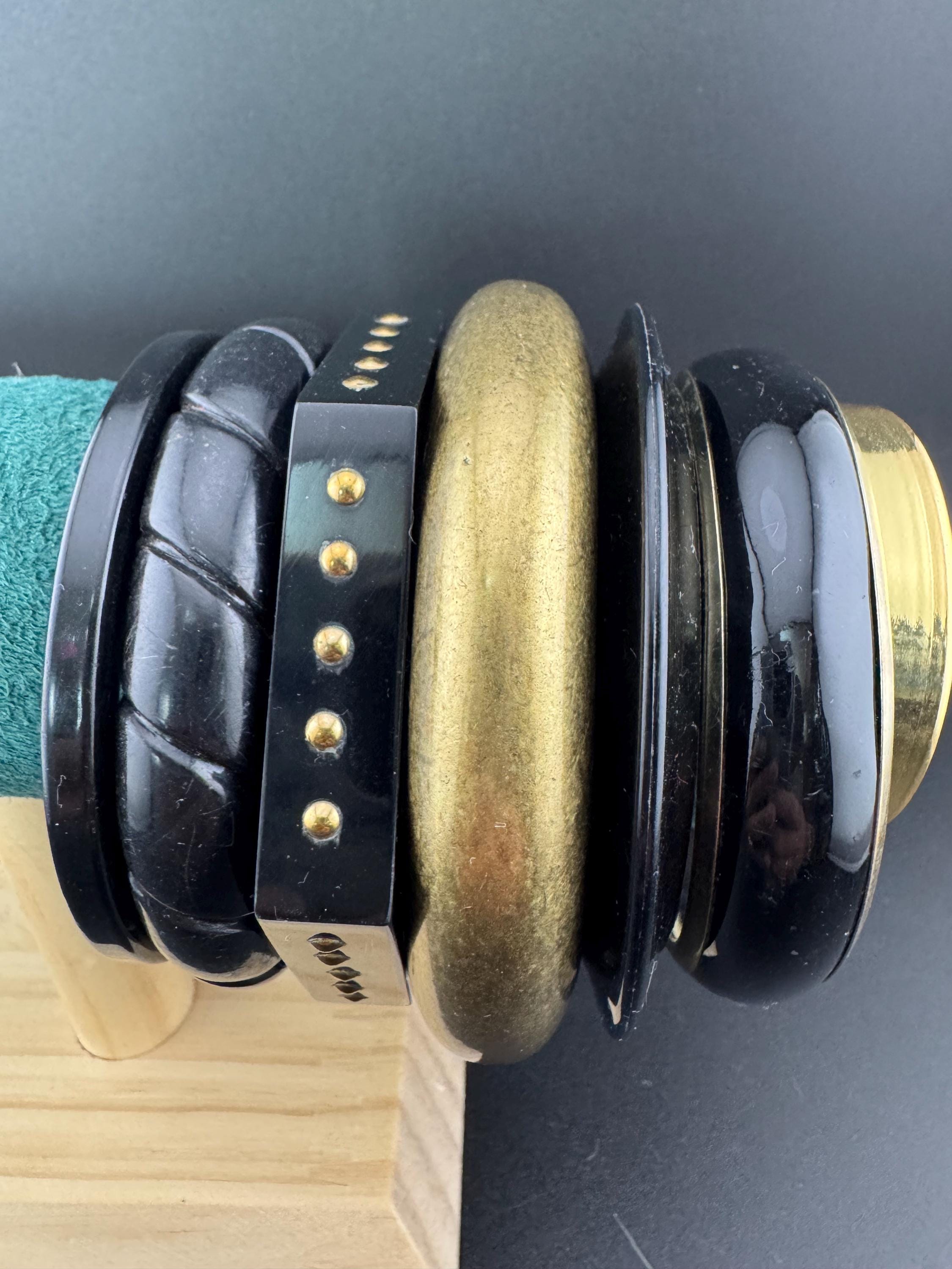 A curated set of vintage and retro gold black tones stacking bangles, boho festival bracelets