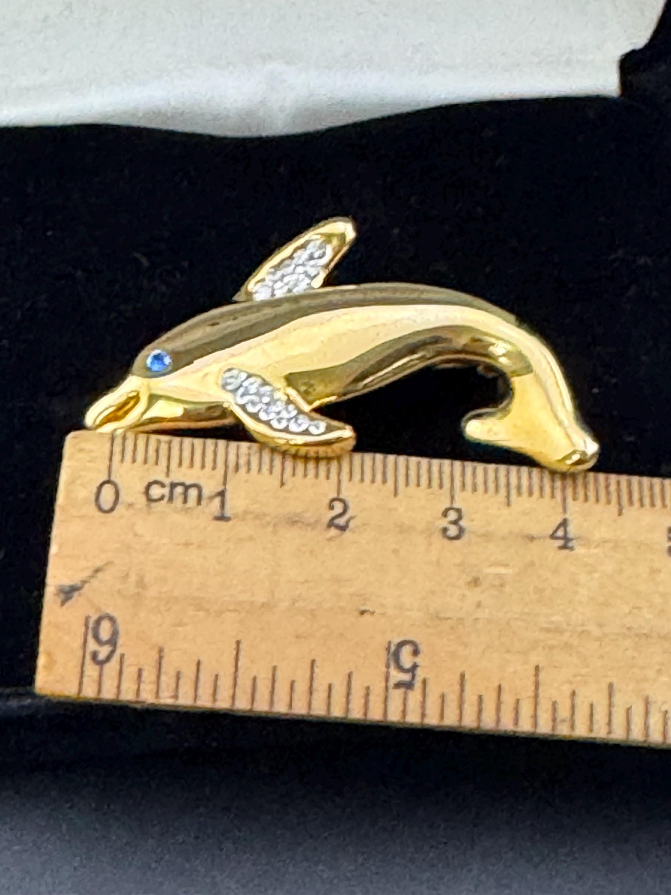 Boxed signed Pierre Cardin gold plated crystal diamanté dolphin brooch