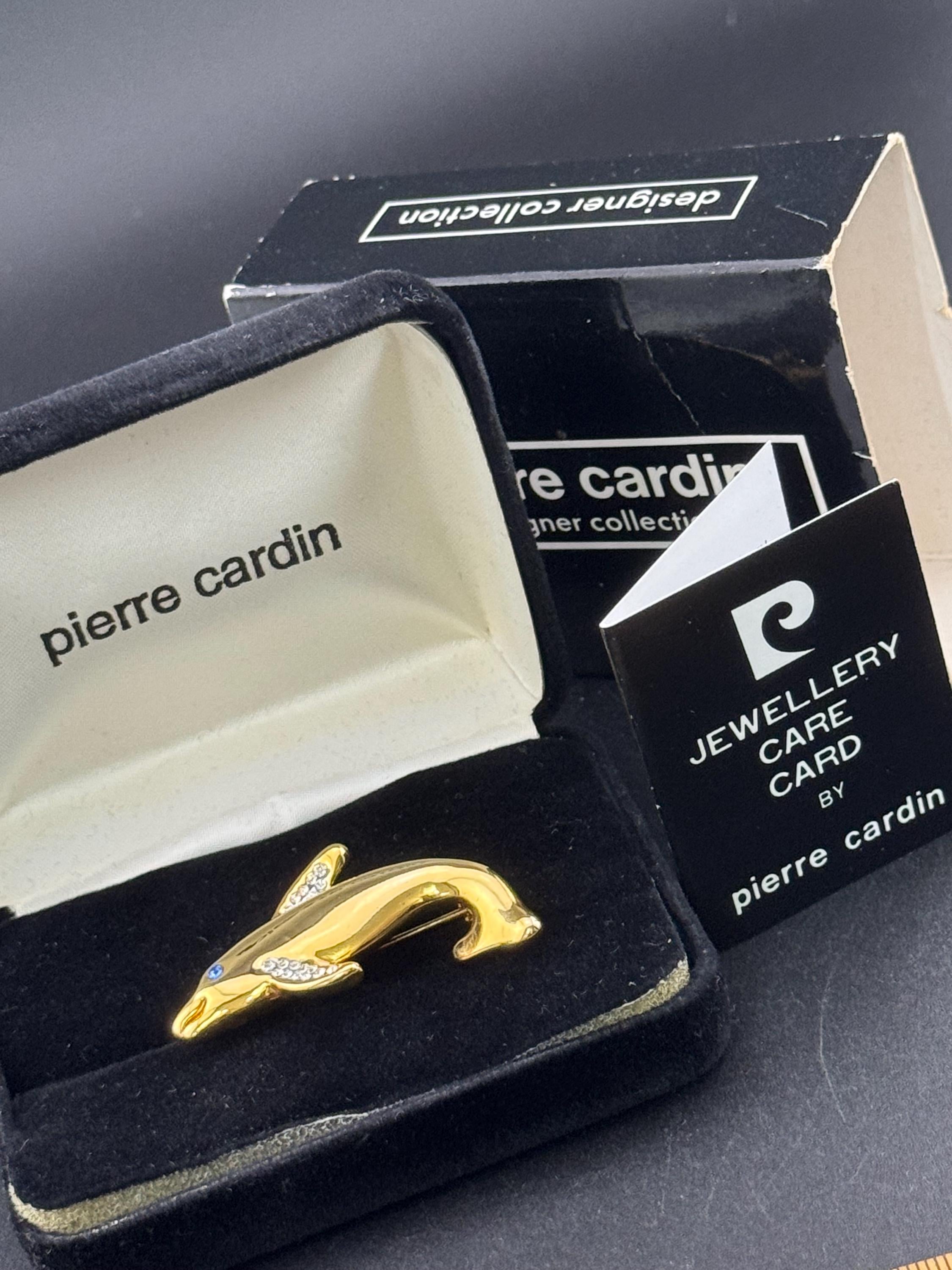 Boxed signed Pierre Cardin gold plated crystal diamanté dolphin brooch