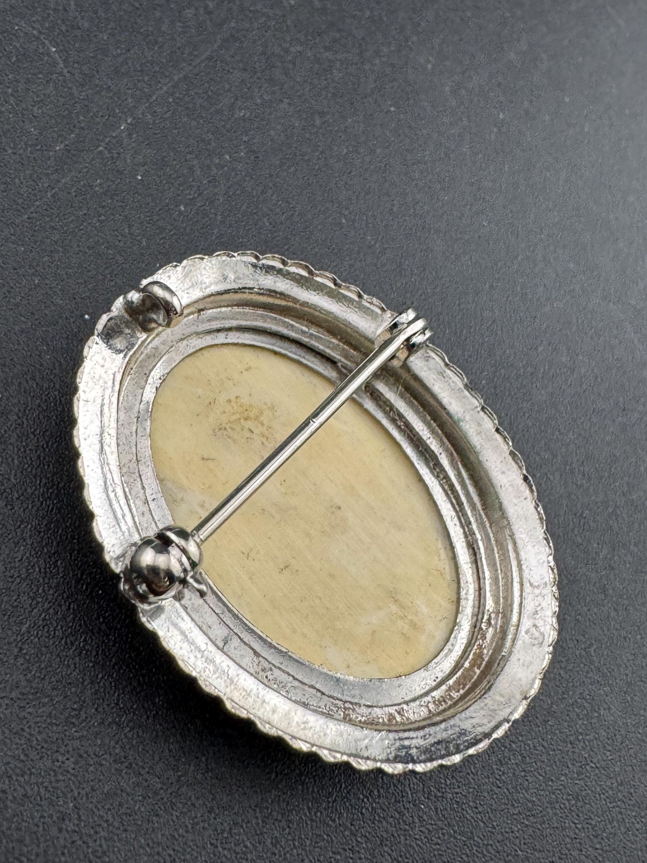 antique style scrimshaw faux bone  silver tone oval brooch, reproduction