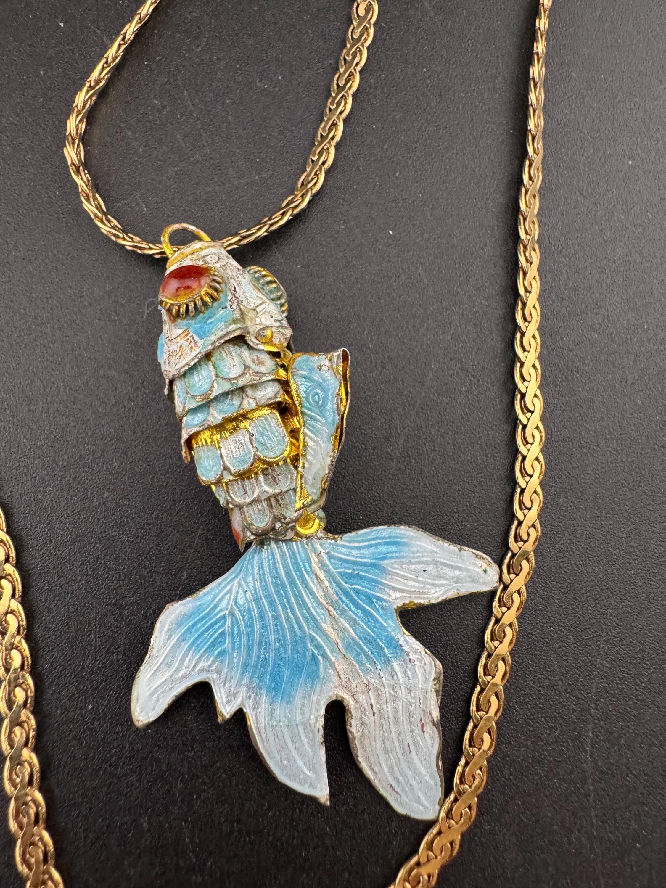 Vintage blue enamel articulated gold fish pendant on a 75 gold plated serpentine chain
