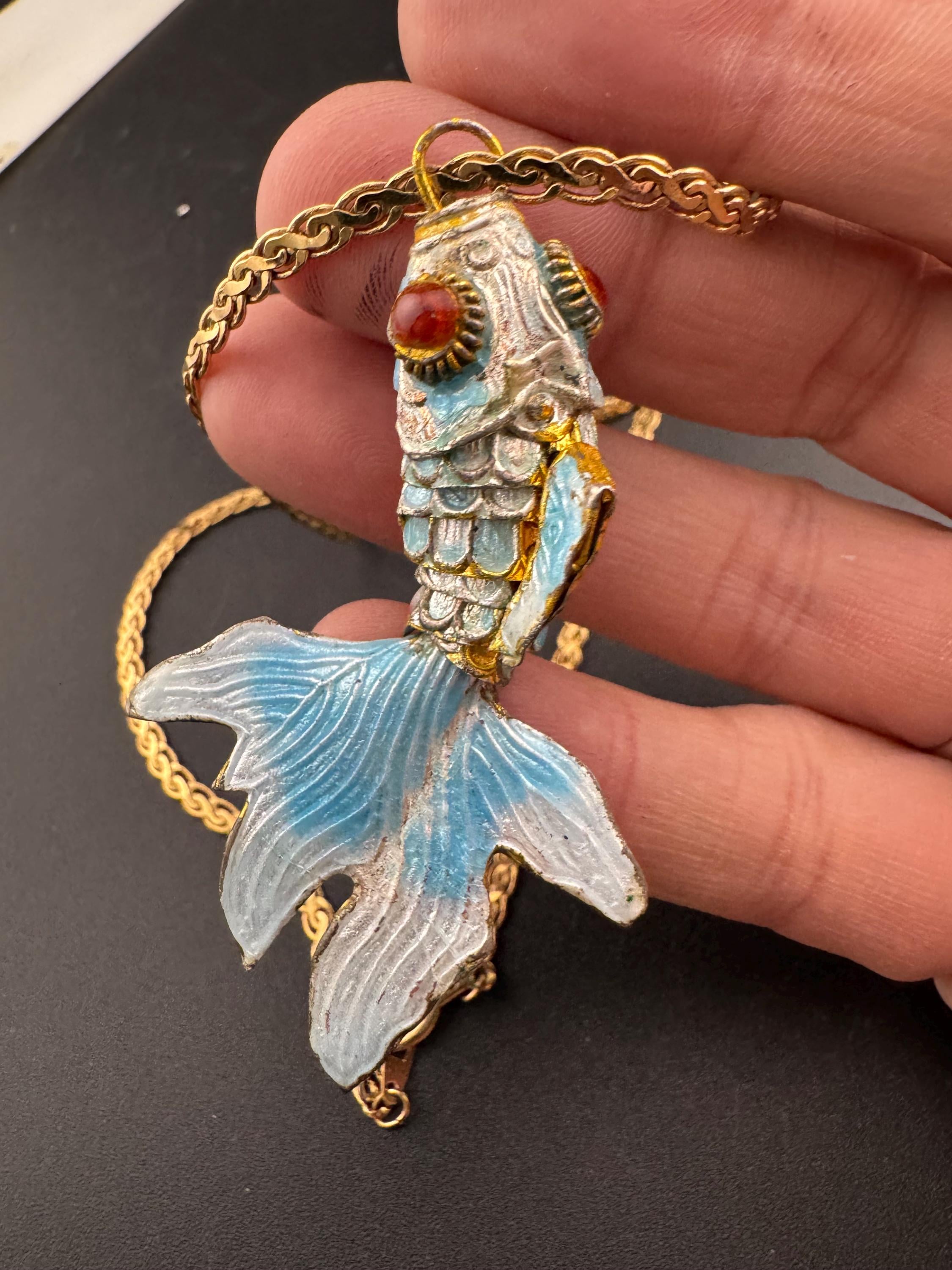 Vintage blue enamel articulated gold fish pendant on a 75 gold plated serpentine chain