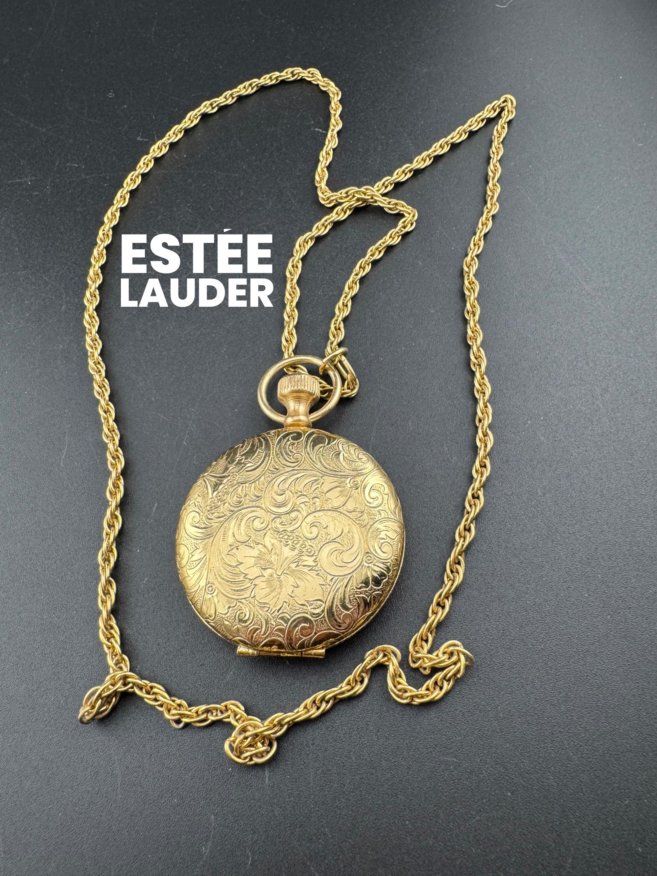 Vintage Estee Lauder ptessed powder pendant necklace gold tone medalion style